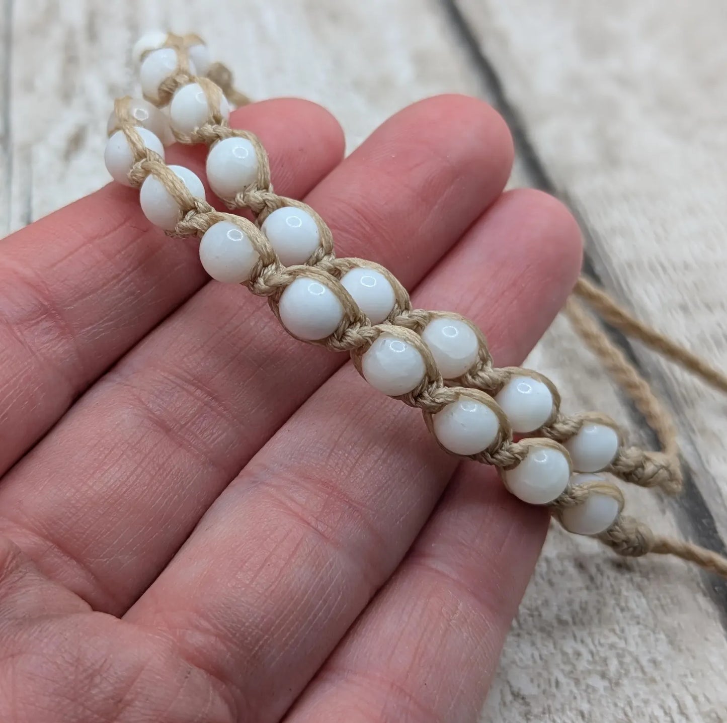 Pellucid shell beaded macramé adjustable bracelet.