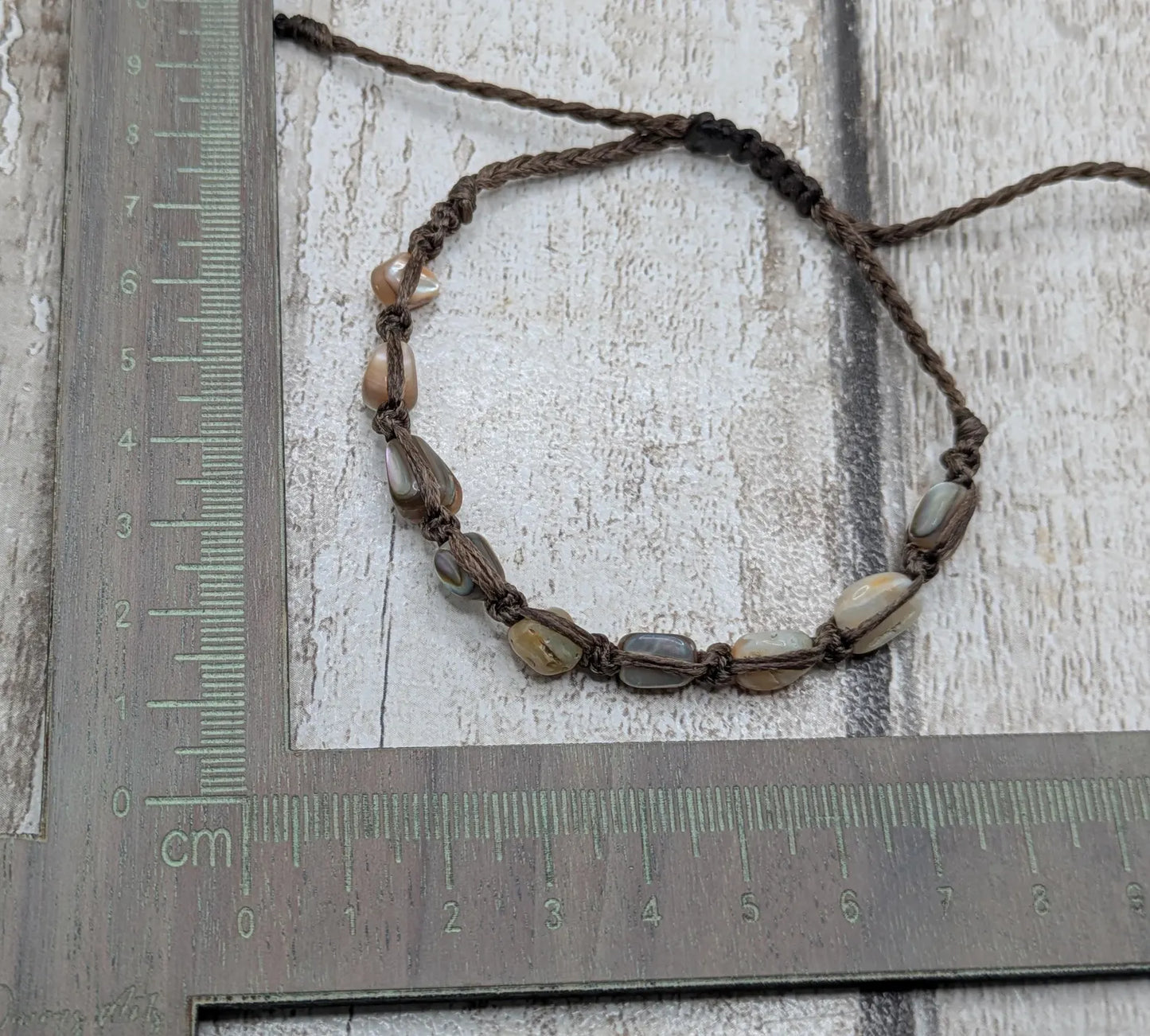 Abalone shell chip beaded adjustable bracelet.
