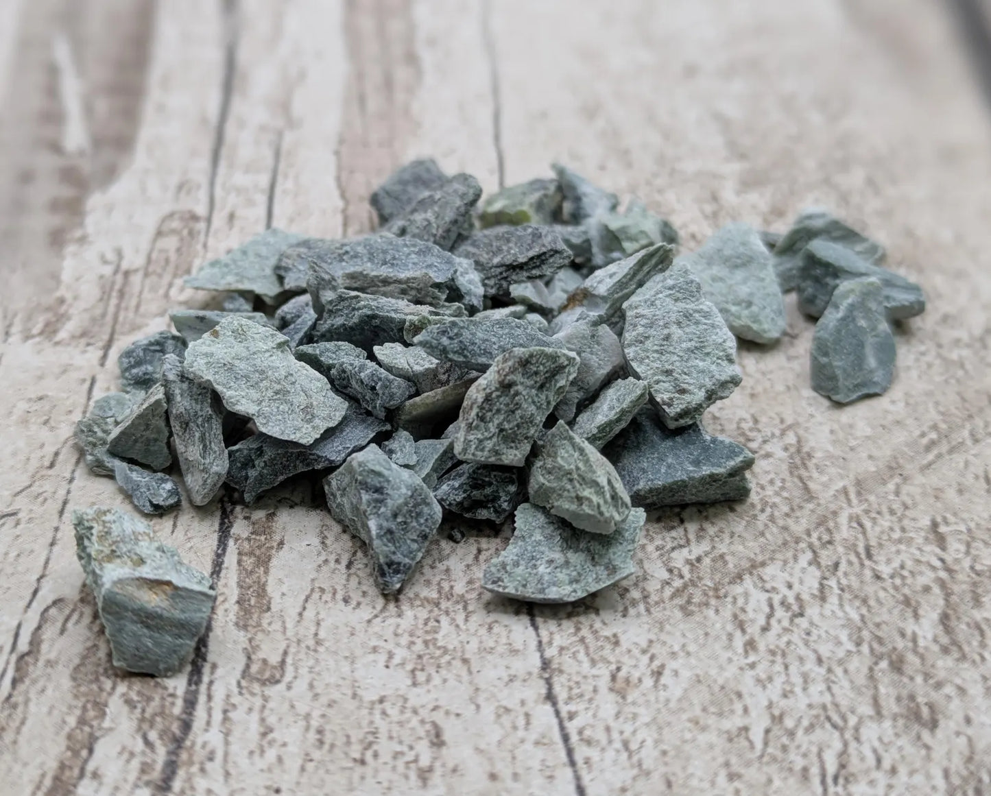 Mixed New Zealand pounamu chips for spell work and inlay.