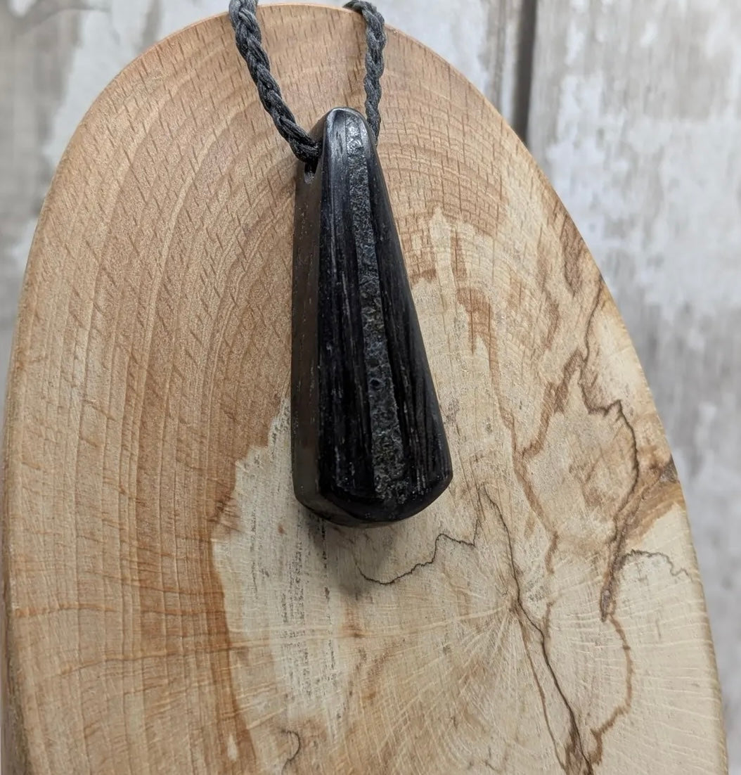 Fenland bog oak with Preseli bluestone roimata pendant.