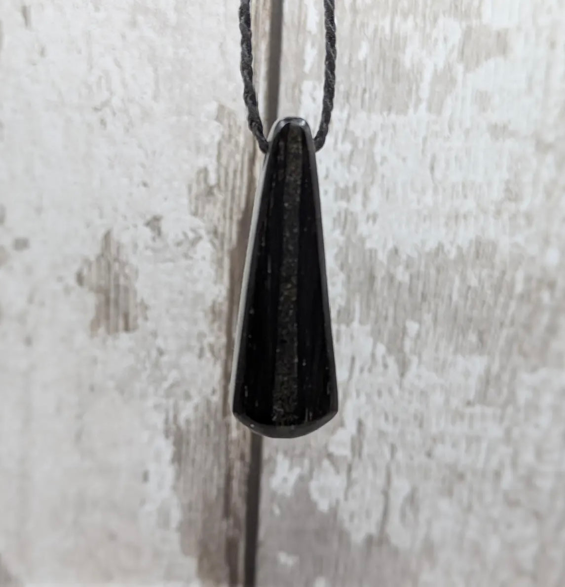 Fenland bog oak with Preseli bluestone roimata pendant.