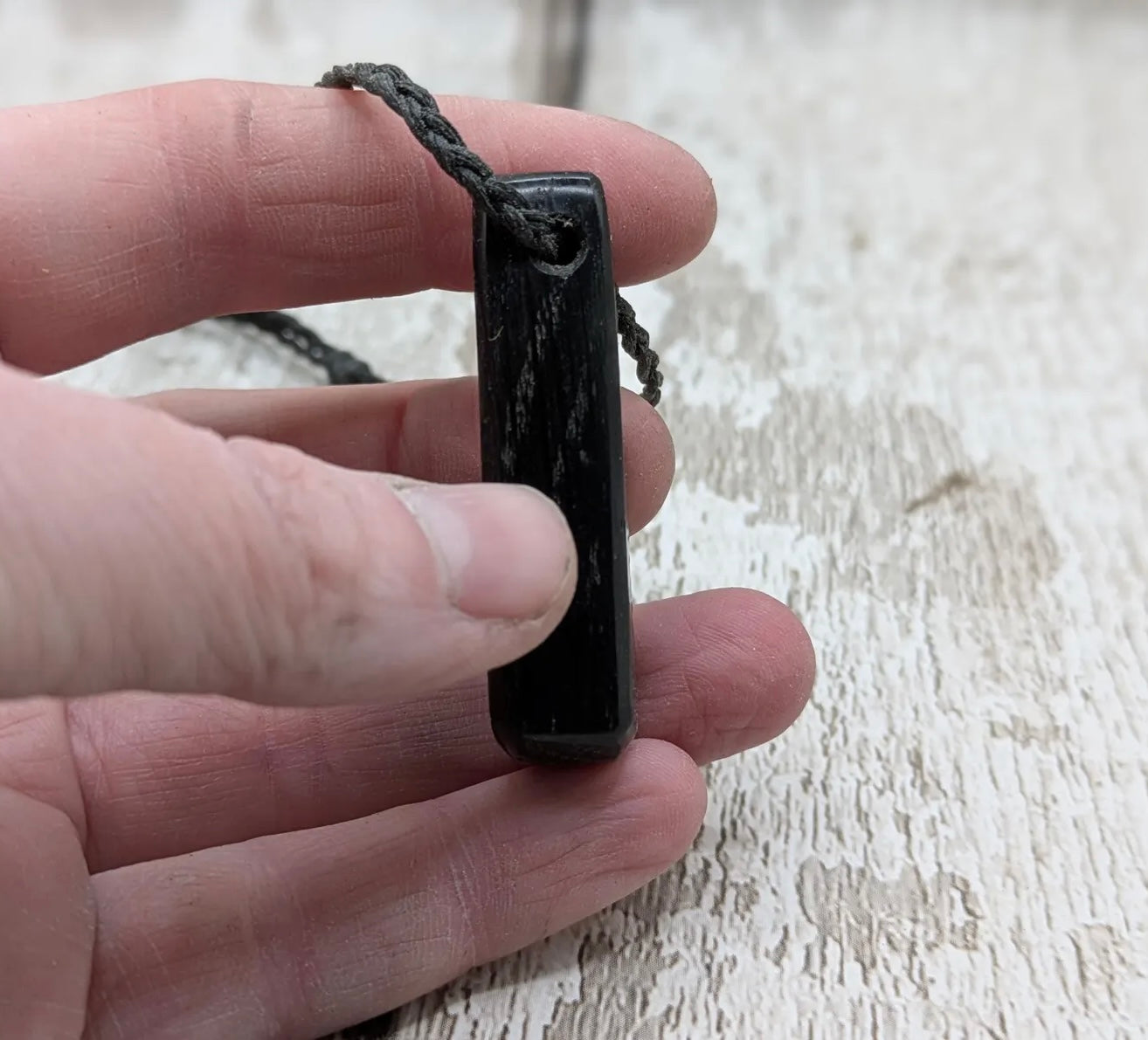 Fenland bog oak with Preseli bluestone roimata pendant.