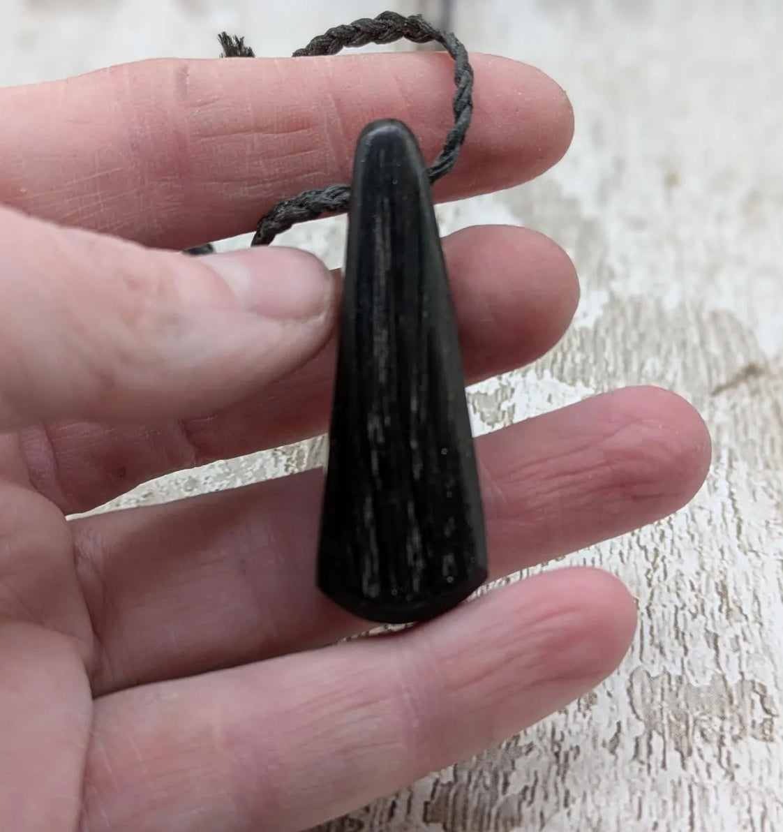 Fenland bog oak with Preseli bluestone roimata pendant.