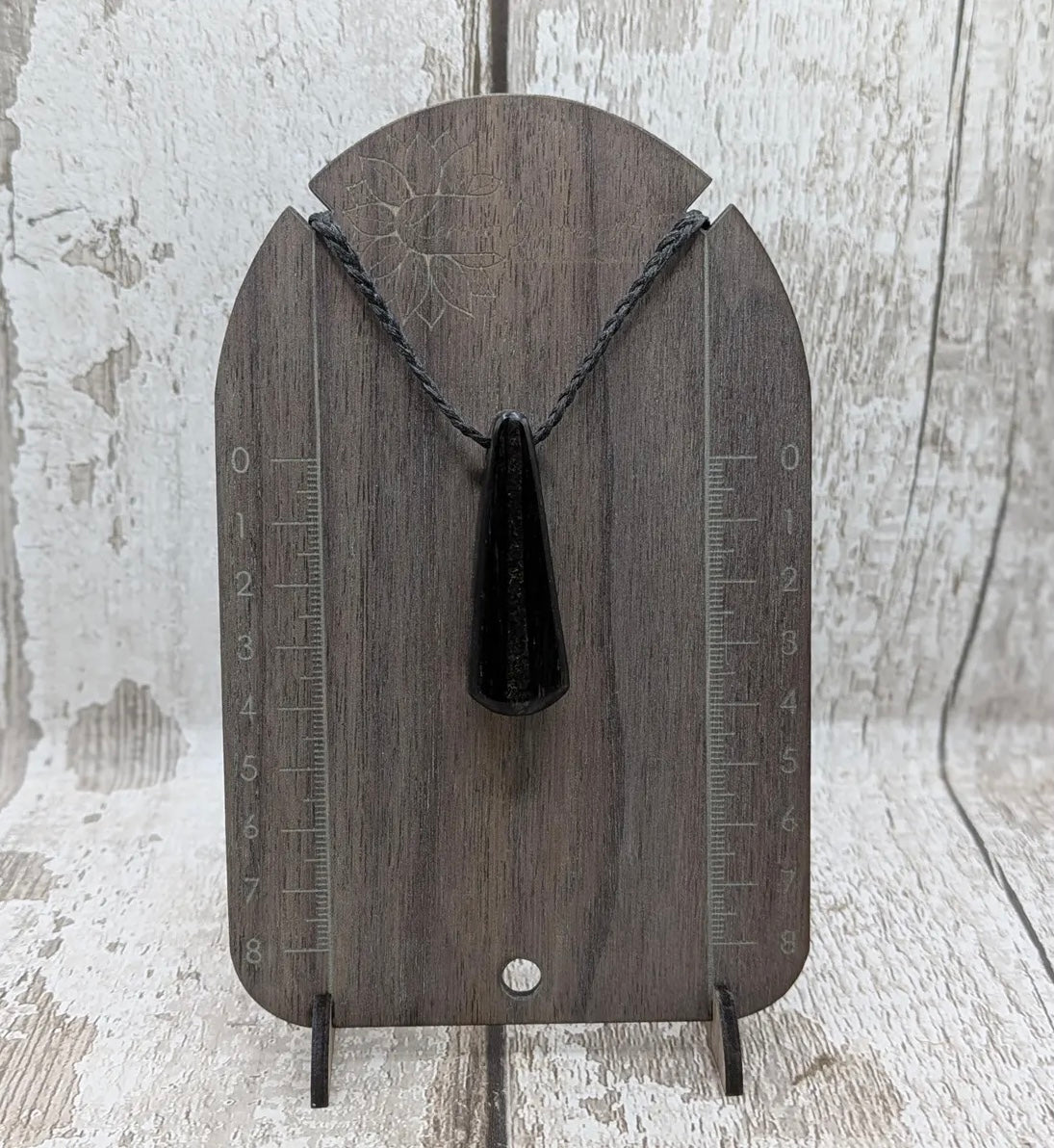 Fenland bog oak with Preseli bluestone roimata pendant.