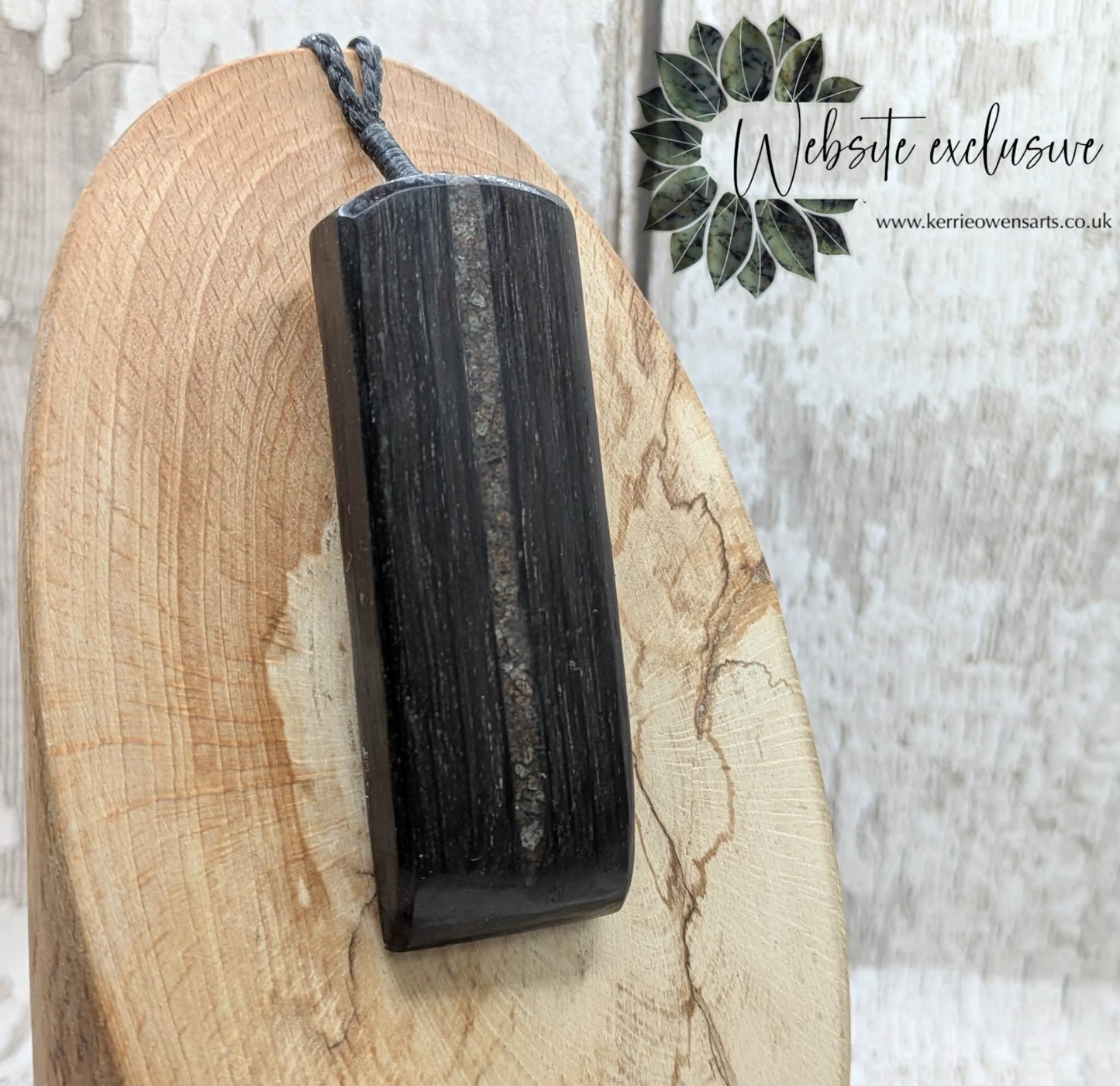 Fenland bog oak with mammoth tooth inlay, Toki adze style pendant.