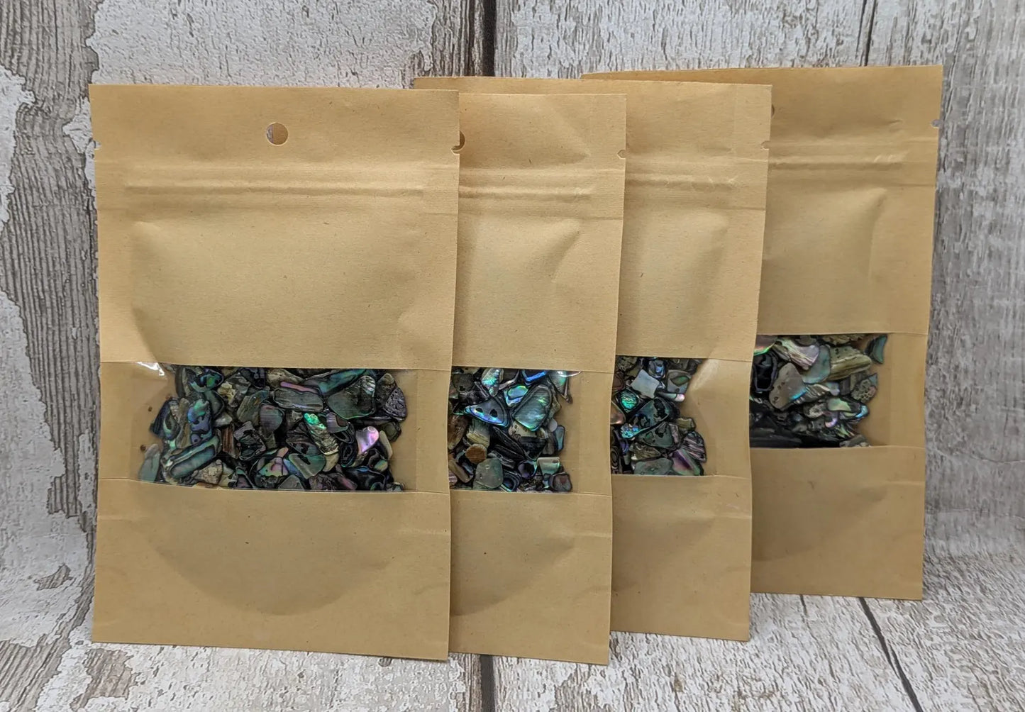 1 pouch New Zealand rainbow pāua abalone shell tumbled chips.