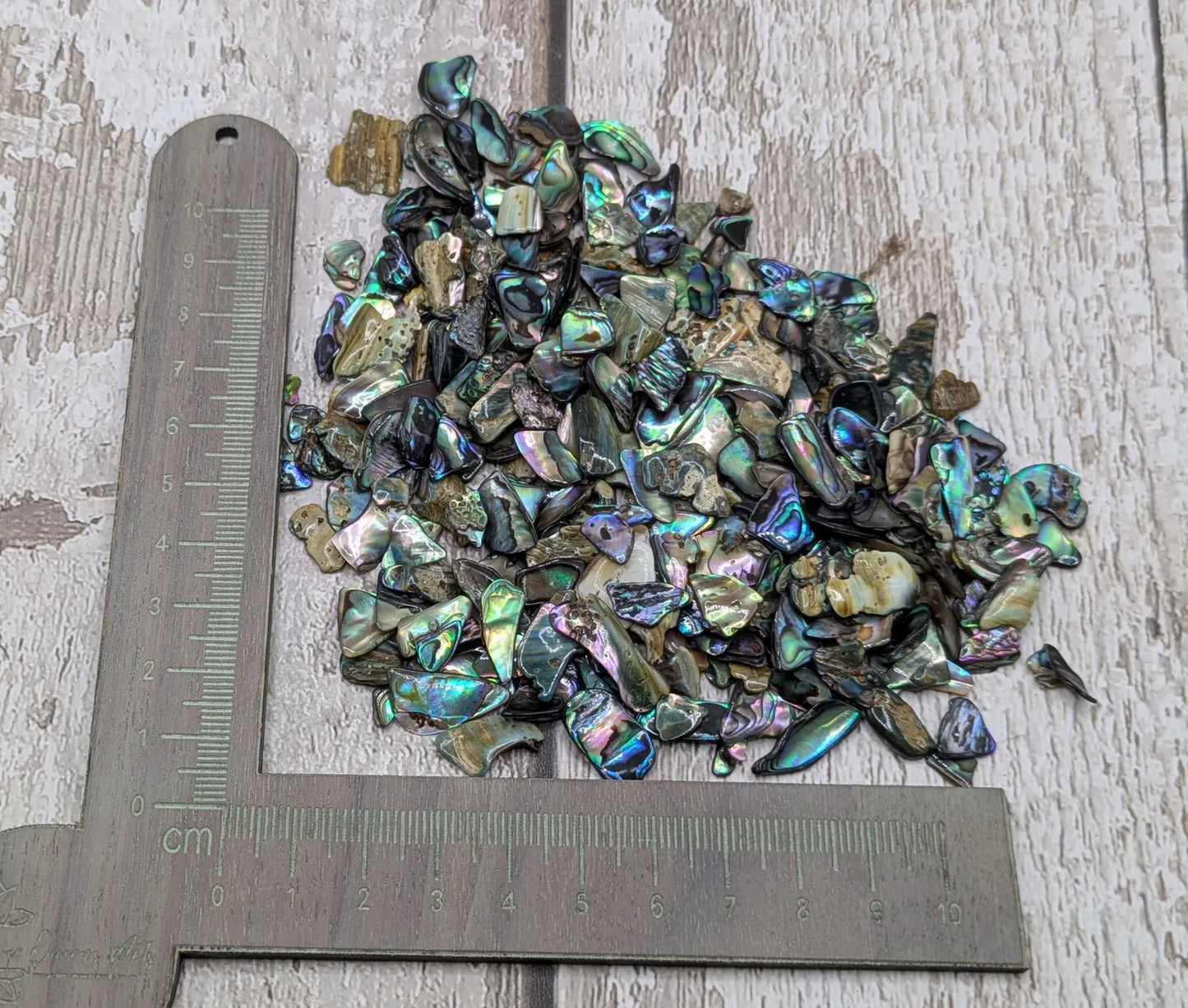 1 pouch New Zealand rainbow pāua abalone shell tumbled chips.