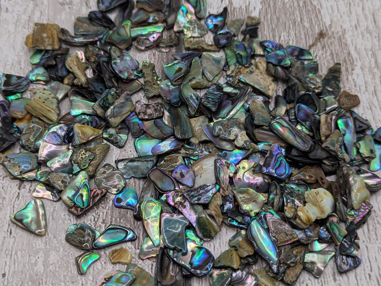 1 pouch New Zealand rainbow pāua abalone shell tumbled chips.