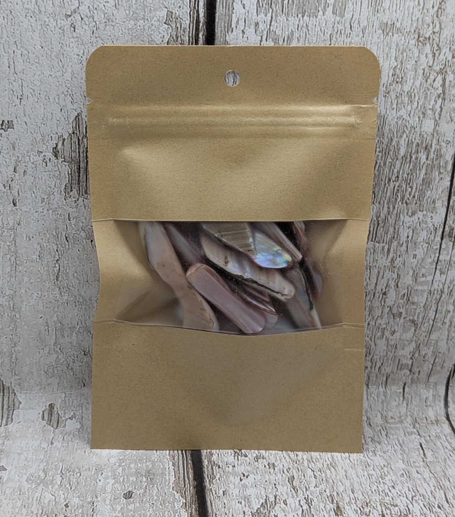 One pouch of New Zealand pink fresh water mussel shell odds.
