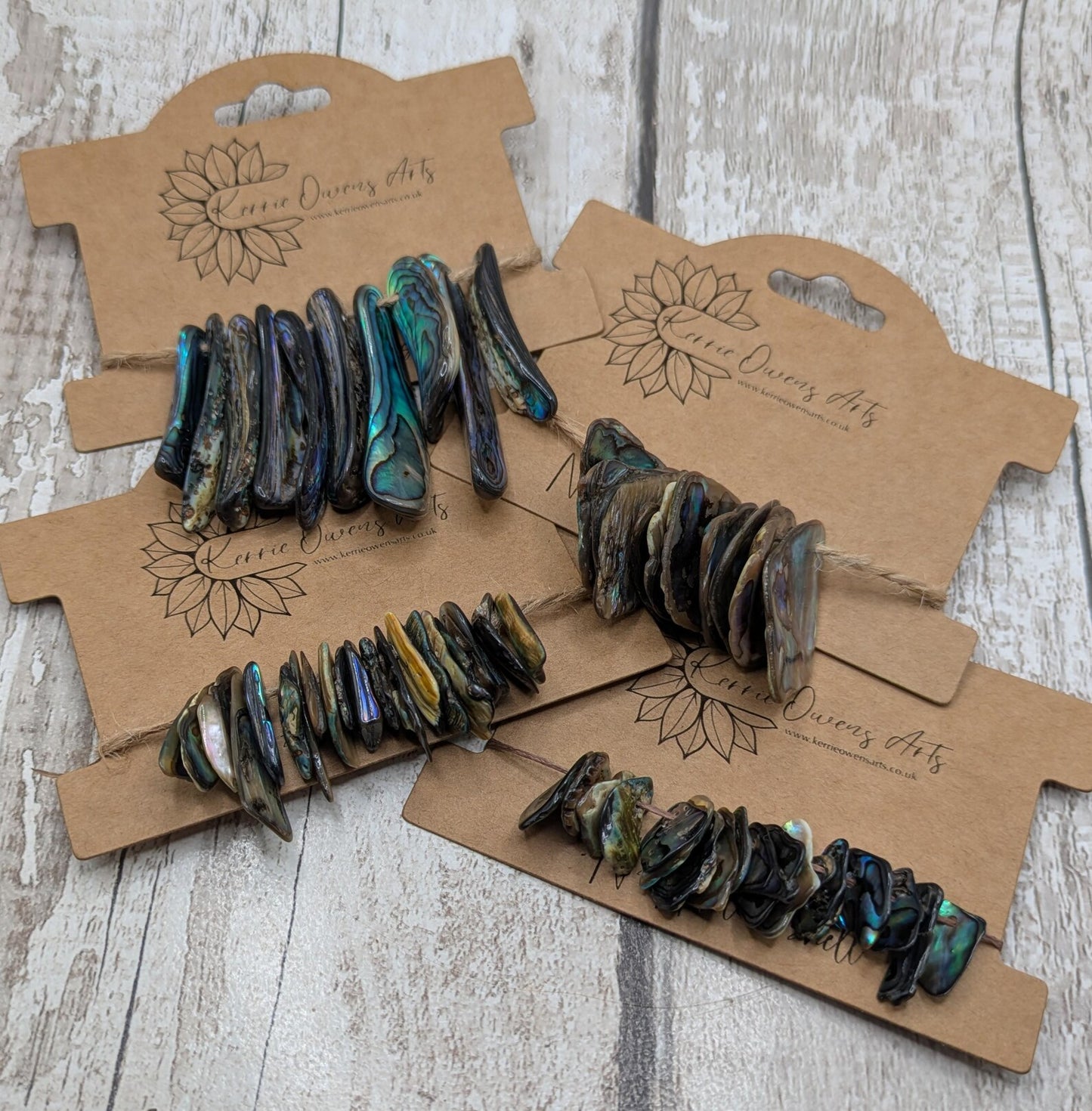 Tiny polished new Zealand rainbow pāua abalone shell beads.