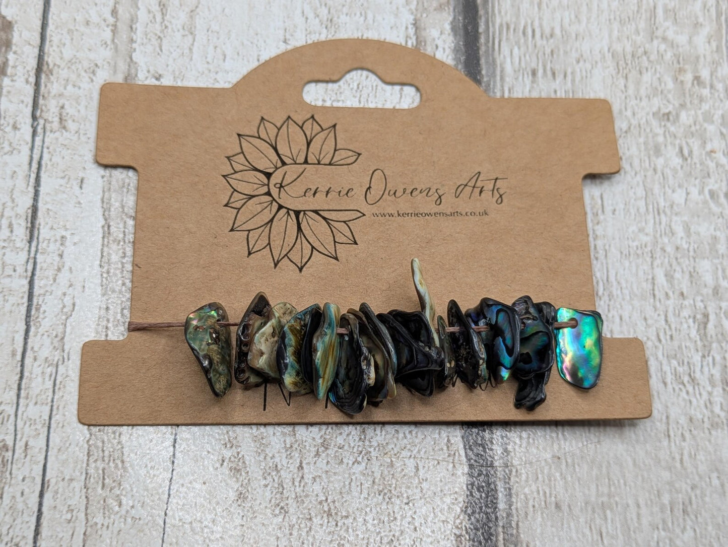 Tiny polished new Zealand rainbow pāua abalone shell beads.