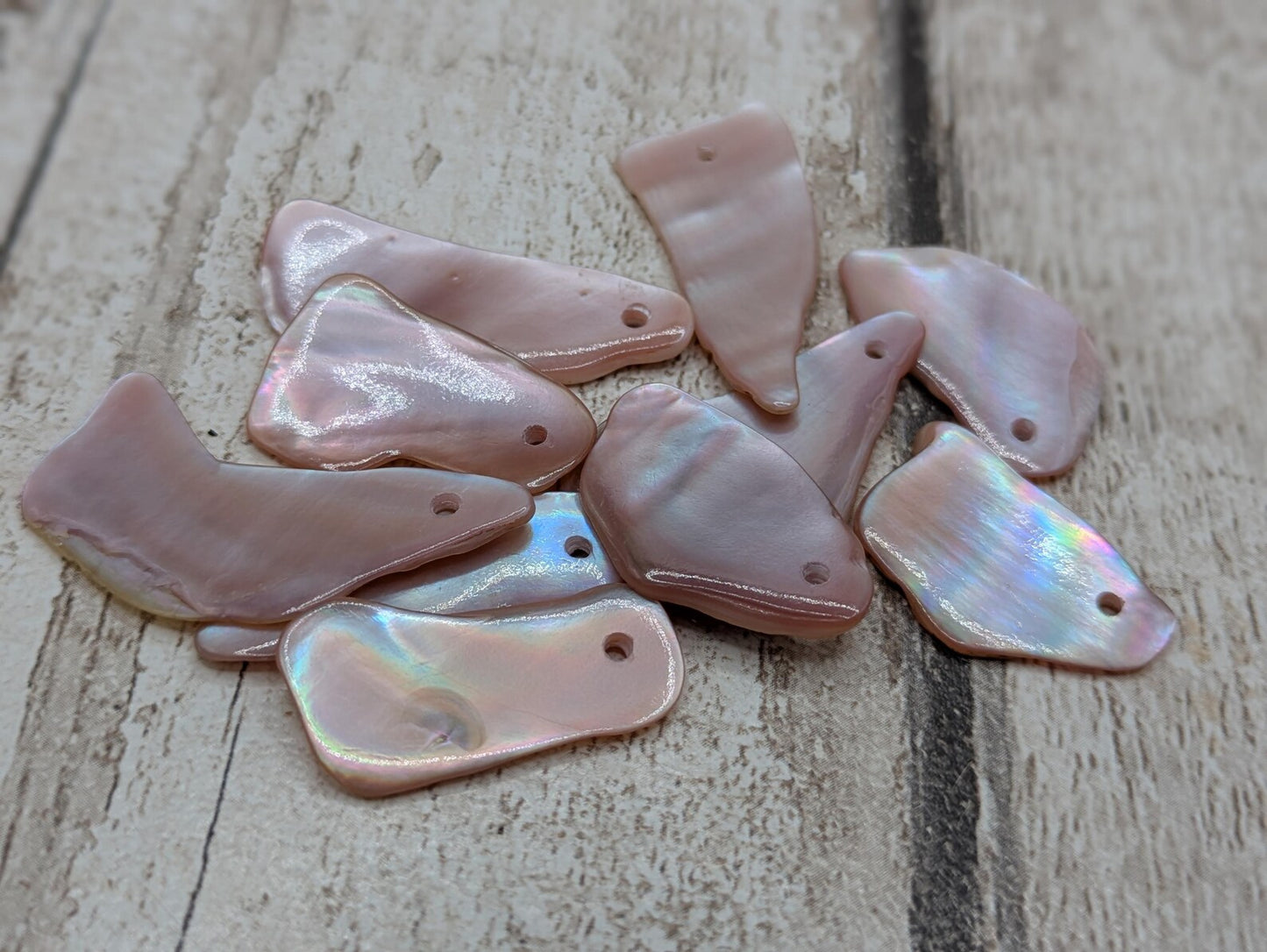 10 New Zealand pink freshwater mussel beads.