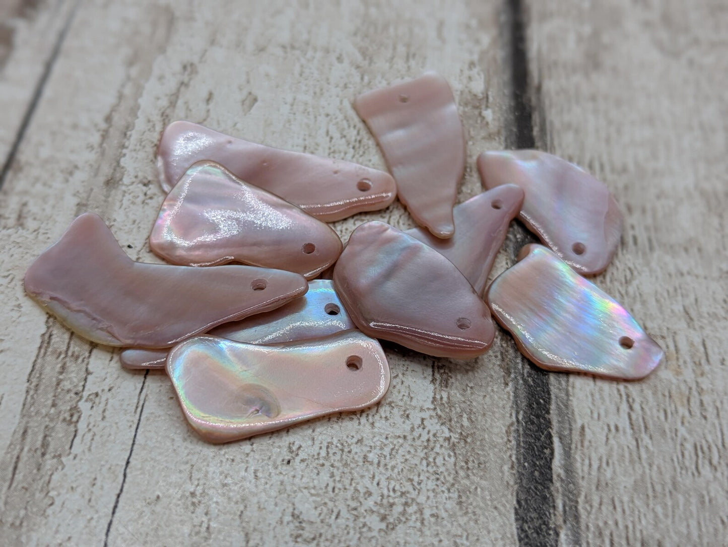 10 New Zealand pink freshwater mussel beads.