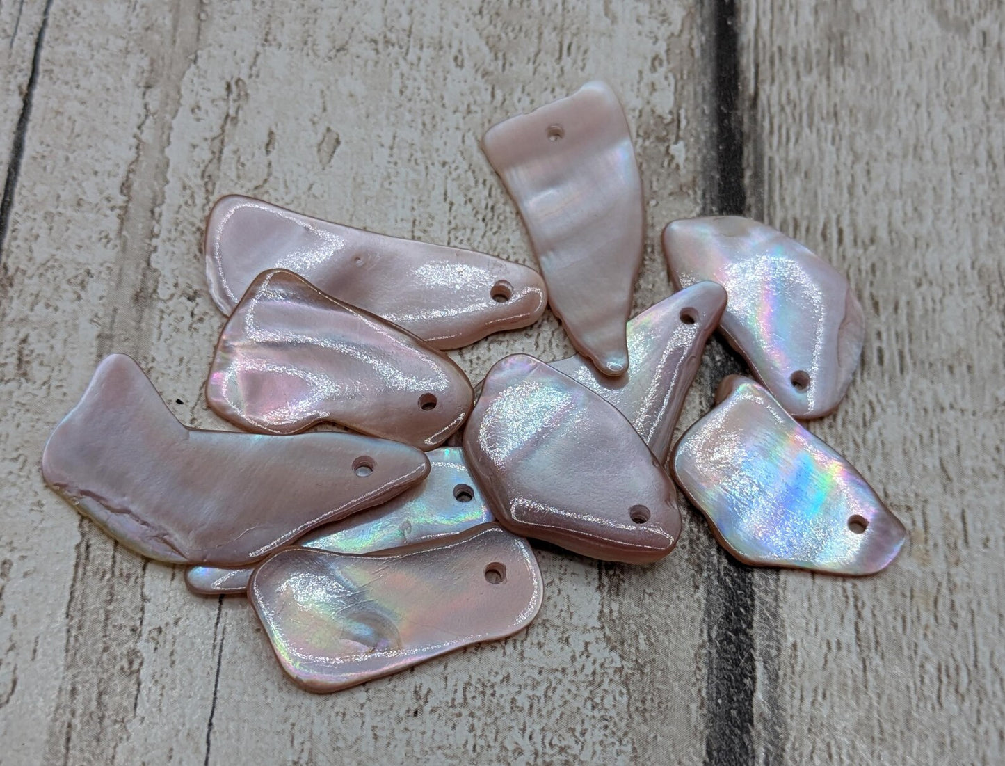 10 New Zealand pink freshwater mussel beads.
