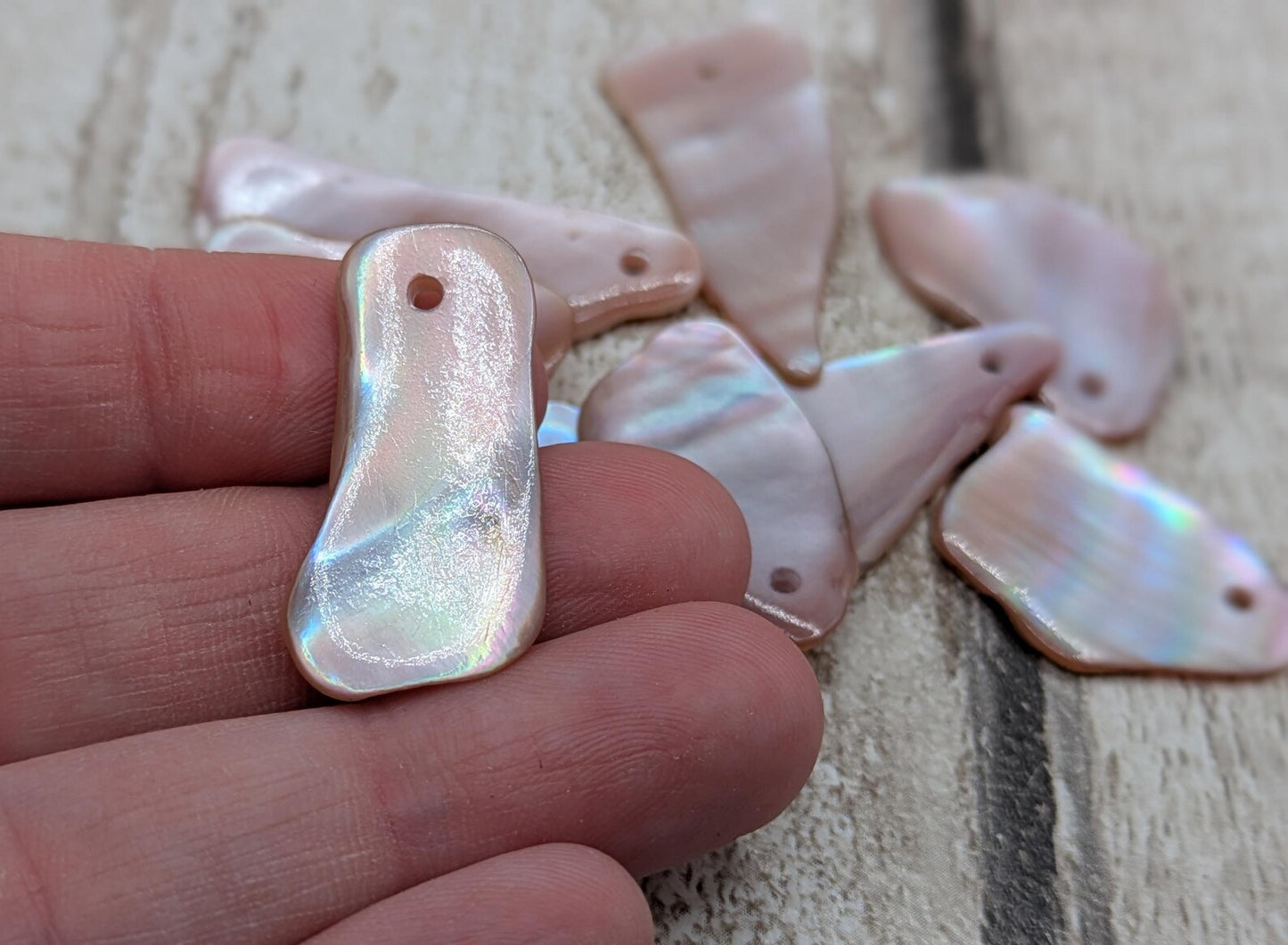 10 New Zealand pink freshwater mussel beads.