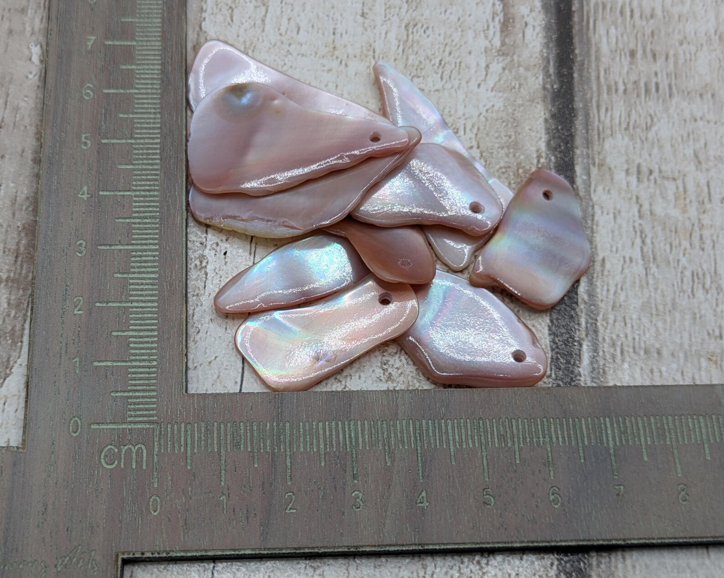 10 New Zealand pink freshwater mussel beads.