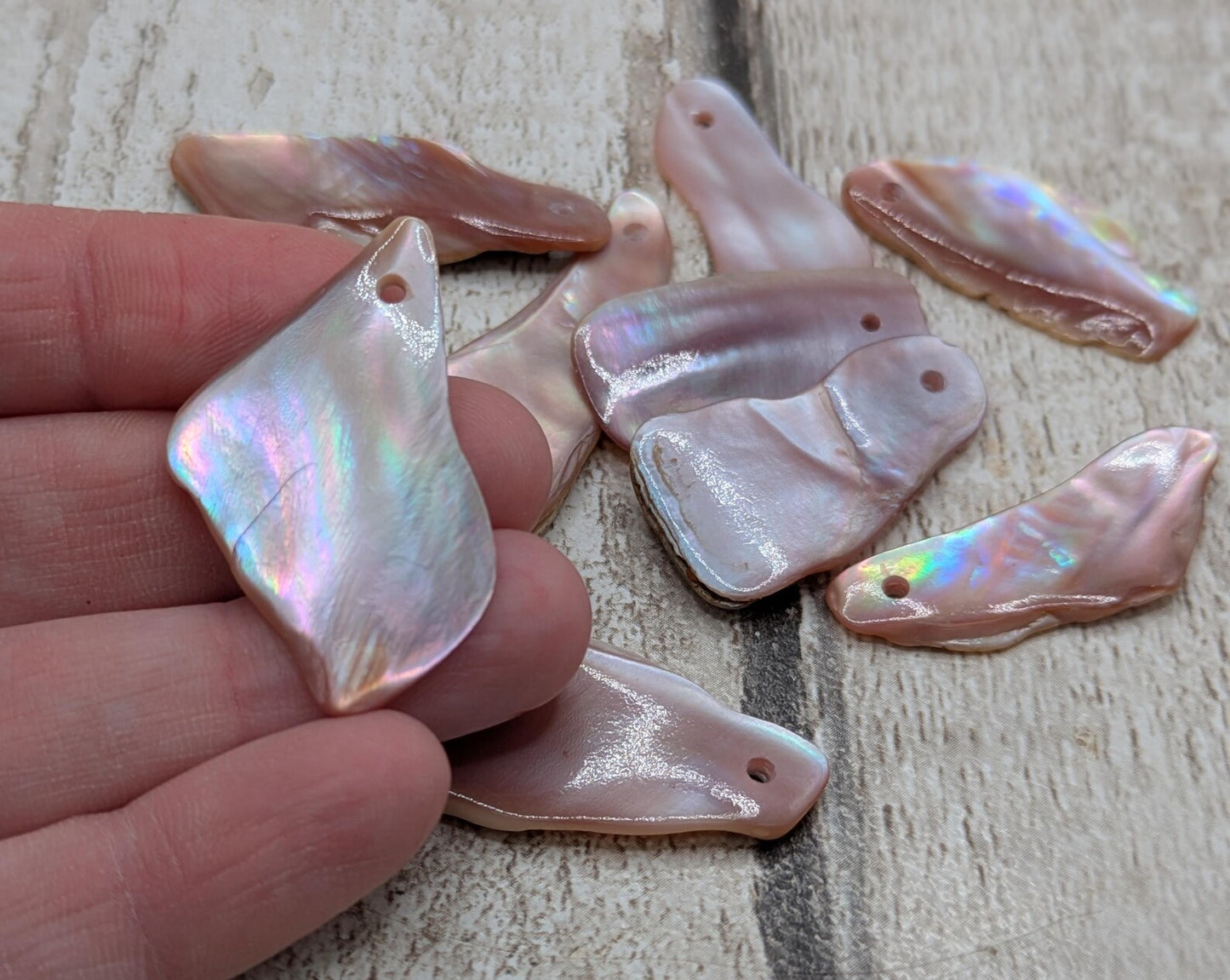 10 New Zealand pink freshwater mussel beads.