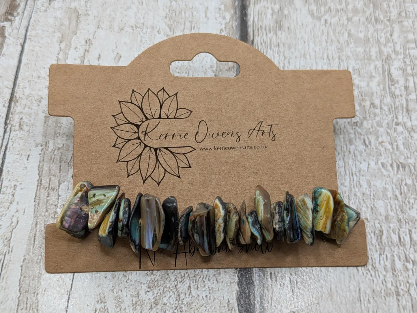 20 central drilled new Zealand rainbow pāua abalone shell beads.