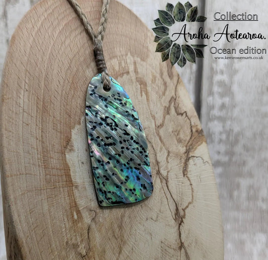 New Zealand Rainbow pāua shell pendant - iridescent abalone necklace, trapezoid shape, oceanic gift, hand crafted jewellery.