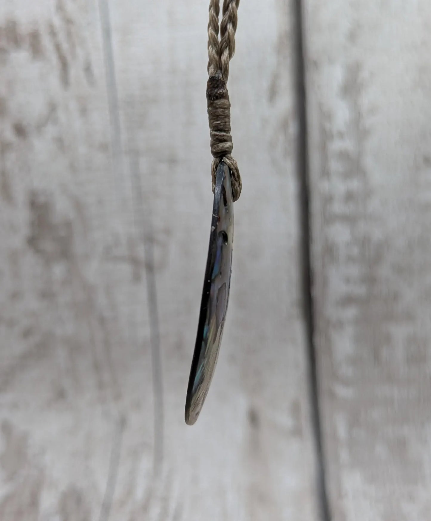 Carved NZ Pāua Shell Oval Pendant – Handcrafted Rainbow Abalone Jewel, Ocean-Inspired fashion, iridescent amulet.