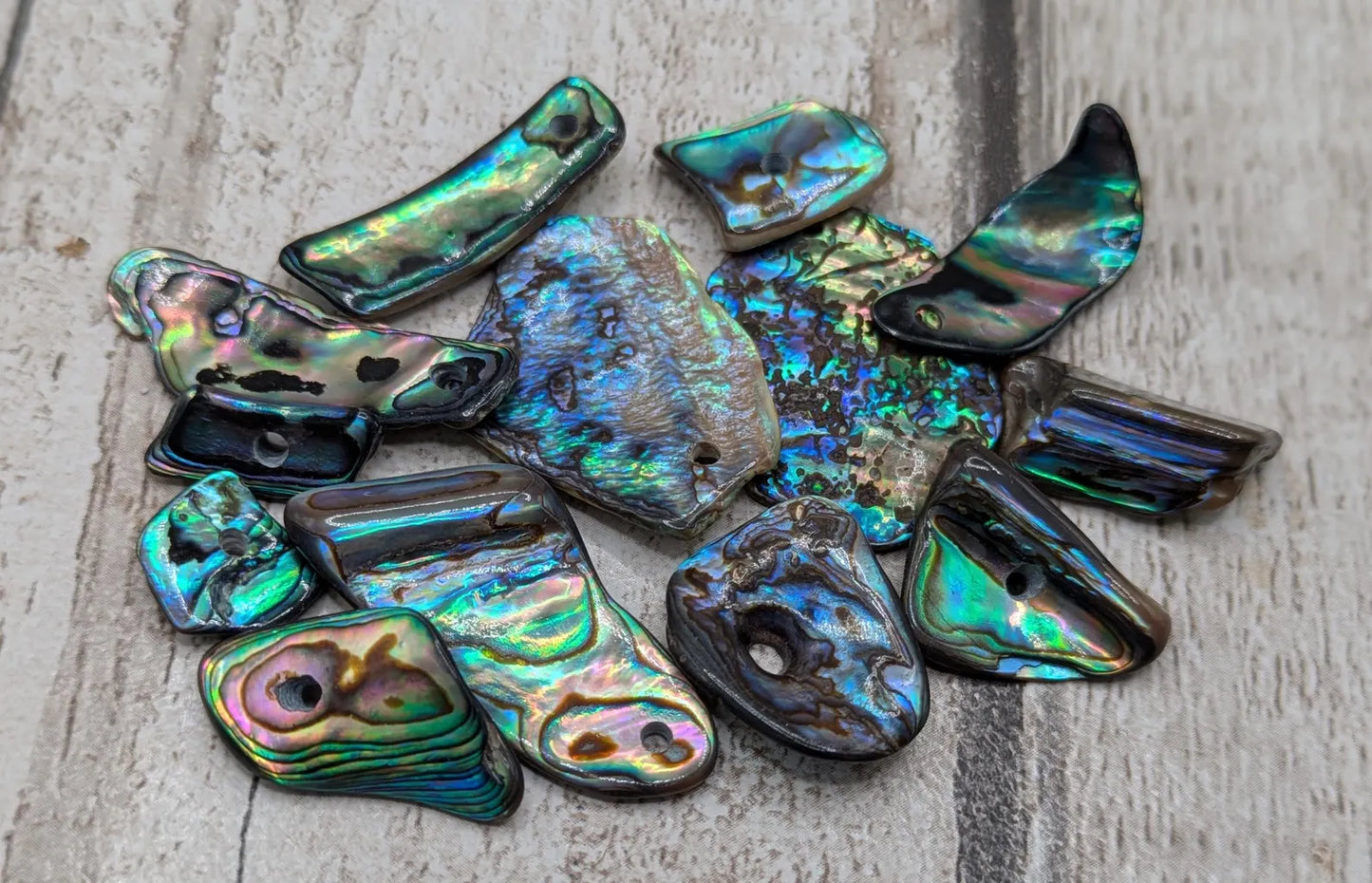 13 New Zealand rainbow pāua abalone shell odd beads.