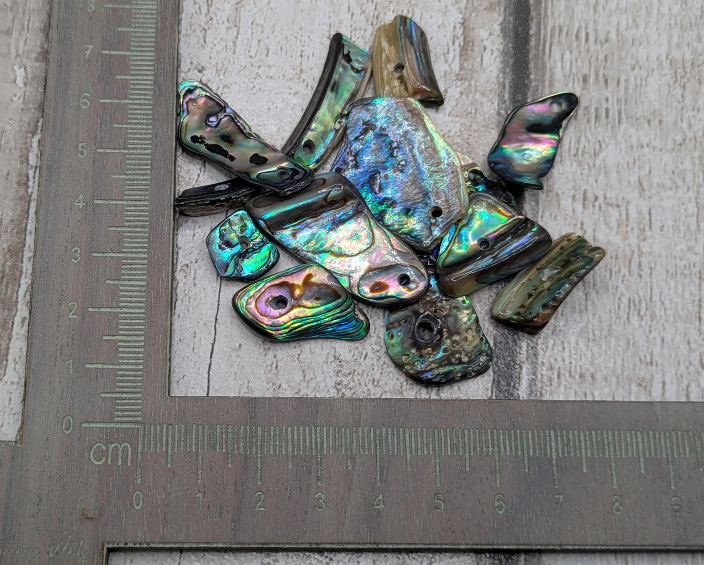 13 New Zealand rainbow pāua abalone shell odd beads.