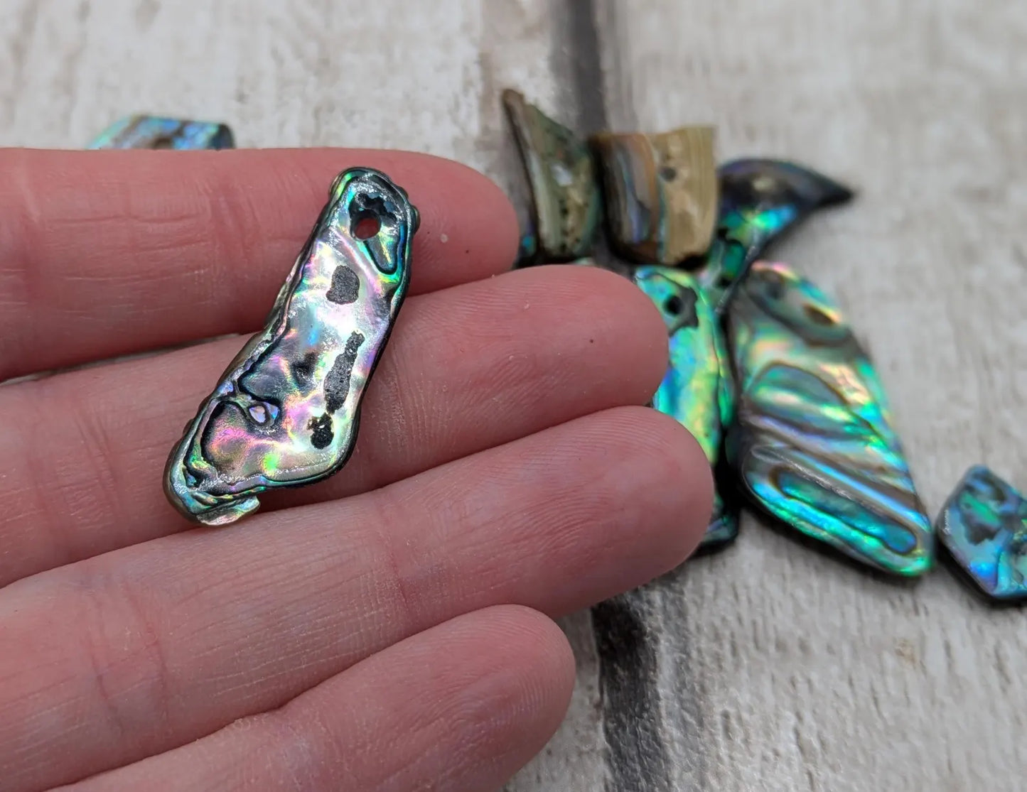 13 New Zealand rainbow pāua abalone shell odd beads.