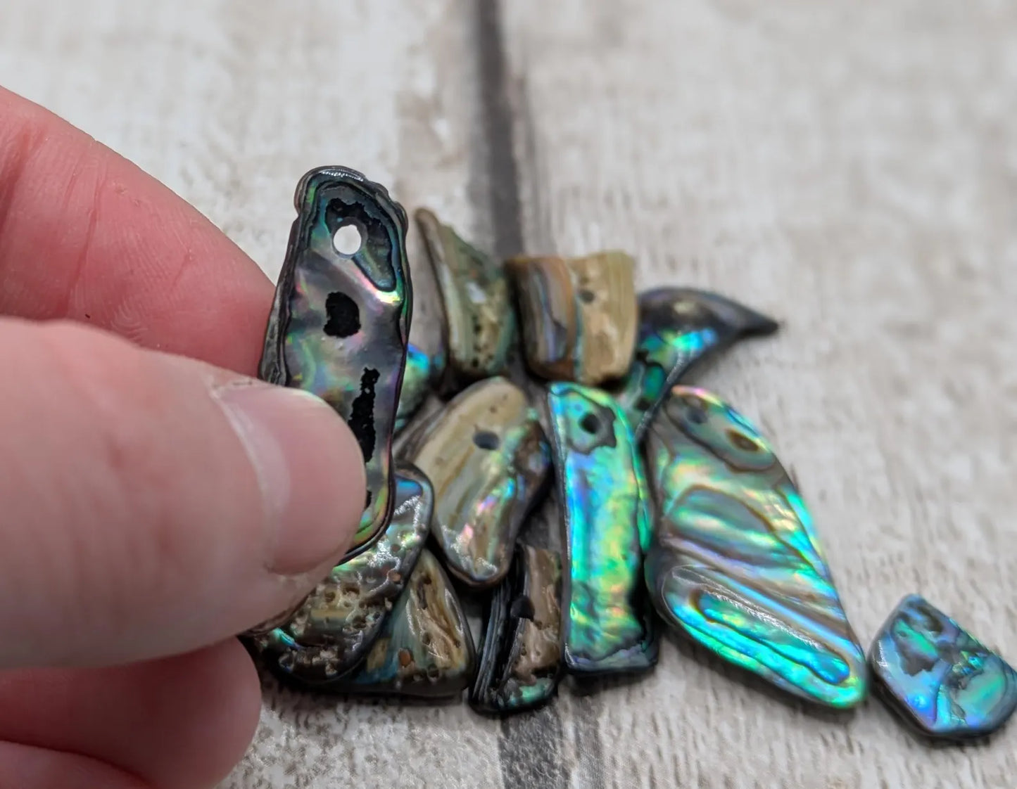 13 New Zealand rainbow pāua abalone shell odd beads.