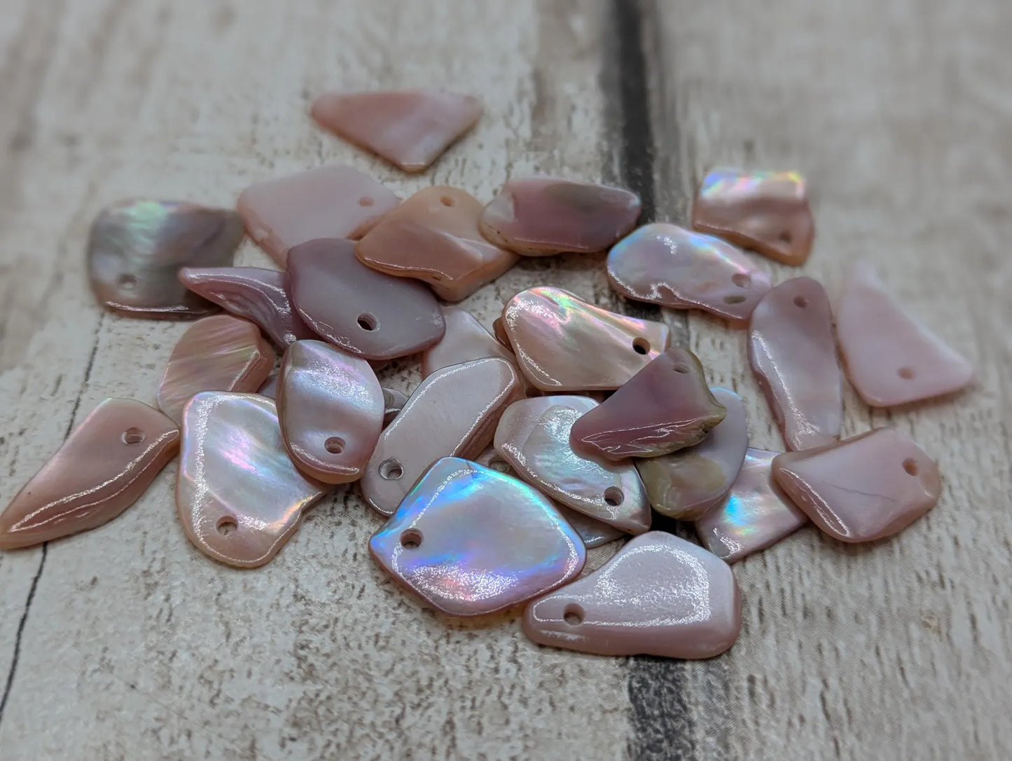 New Zealand top drilled tumbled pink fresh water mussel shell.