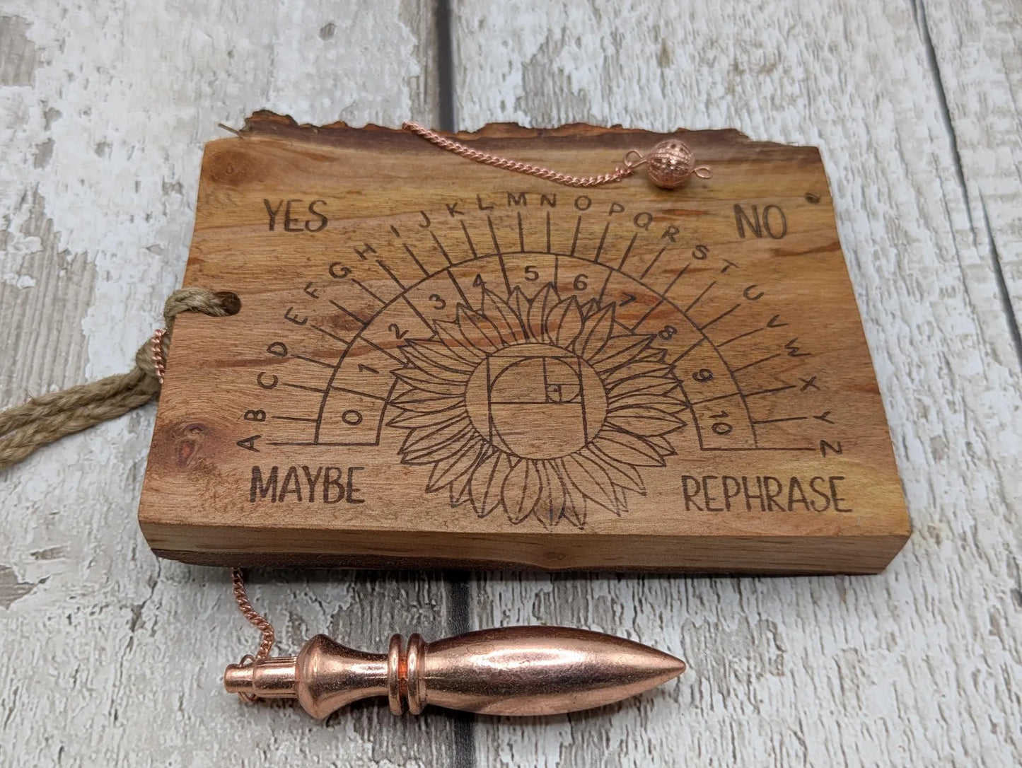 Alder wood pendulum divination board With sunflower design.