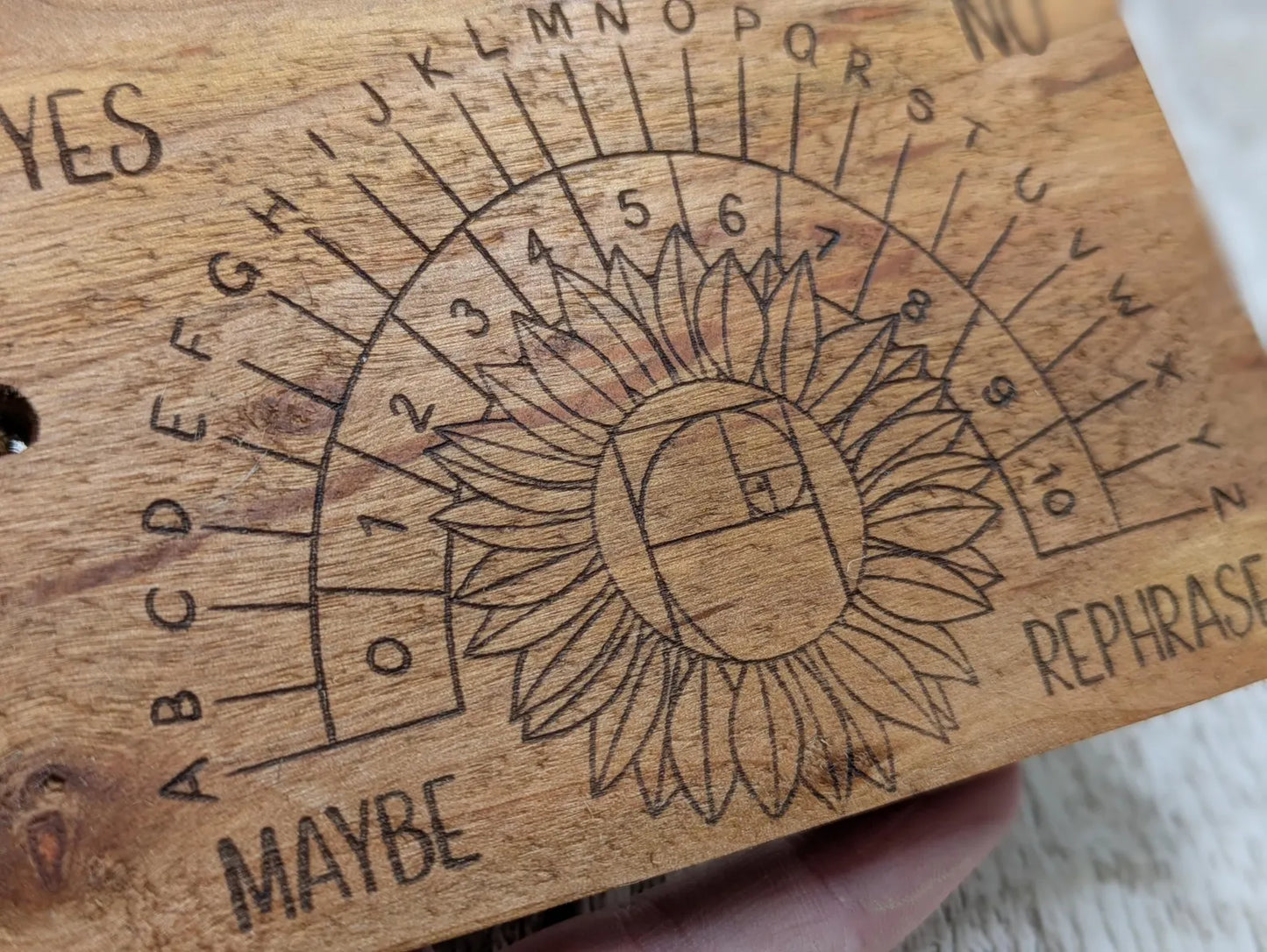 Alder wood pendulum divination board With sunflower design.