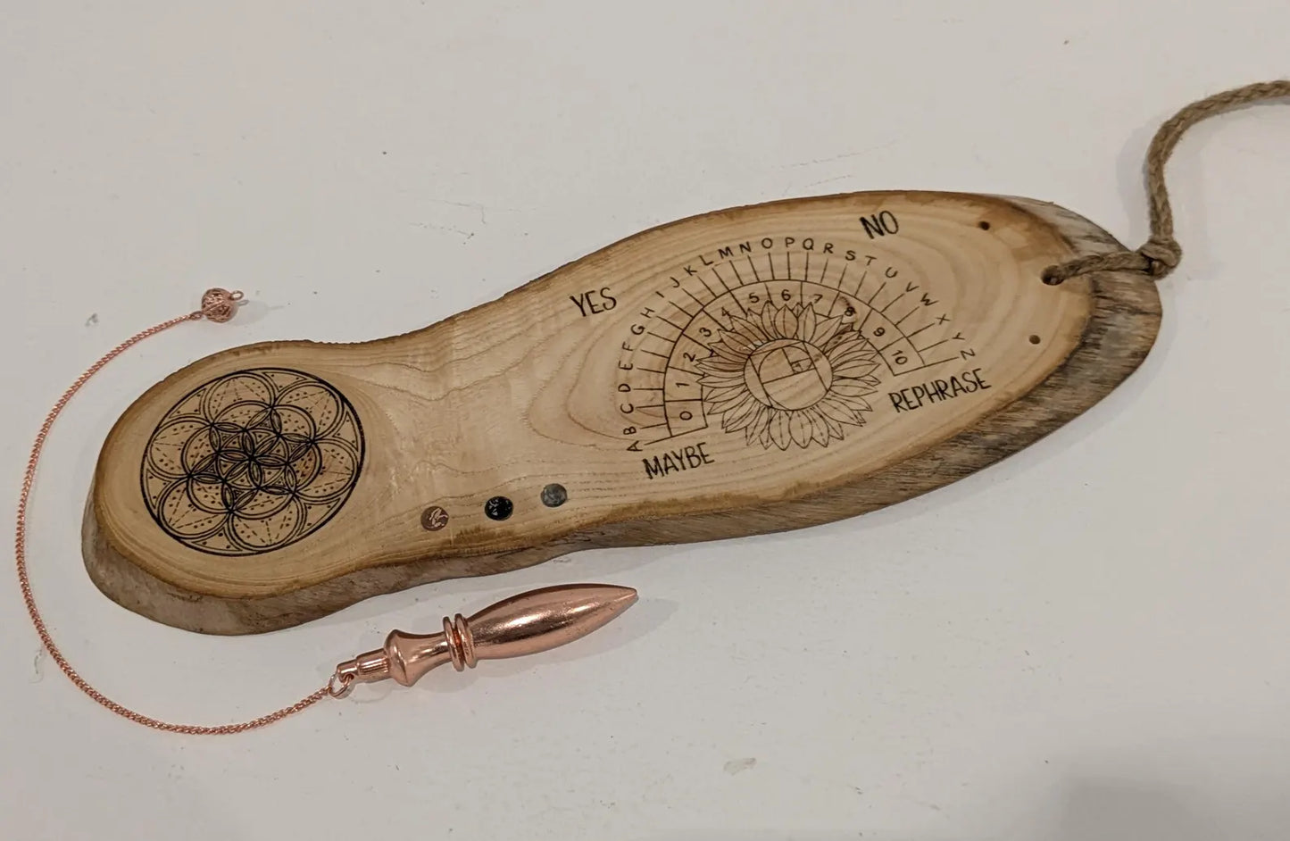 Ash wood pendulum dowsing pendulum board laser printed, with sunflower design.