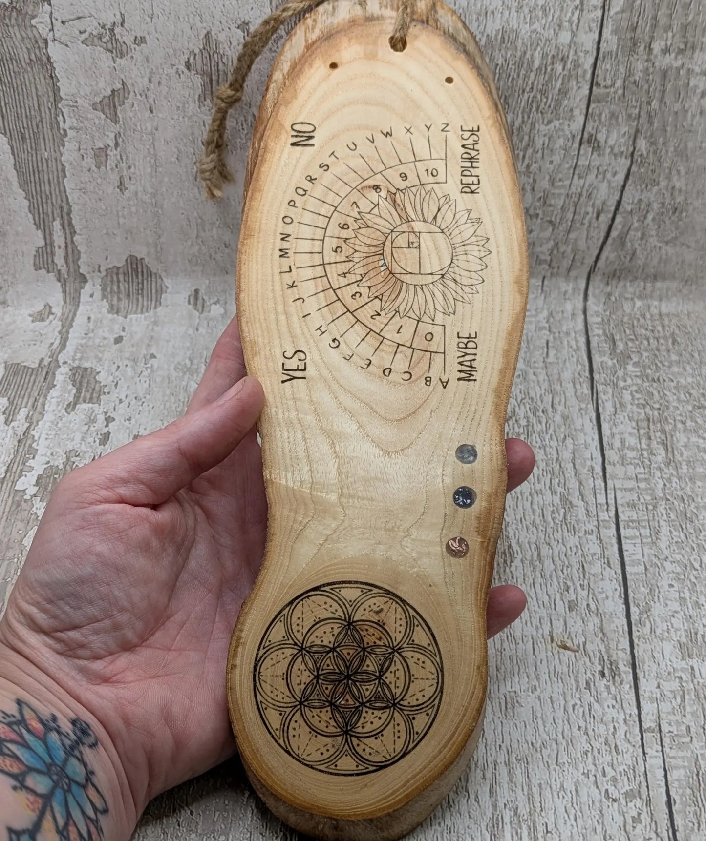Ash wood pendulum dowsing pendulum board laser printed, with sunflower design.