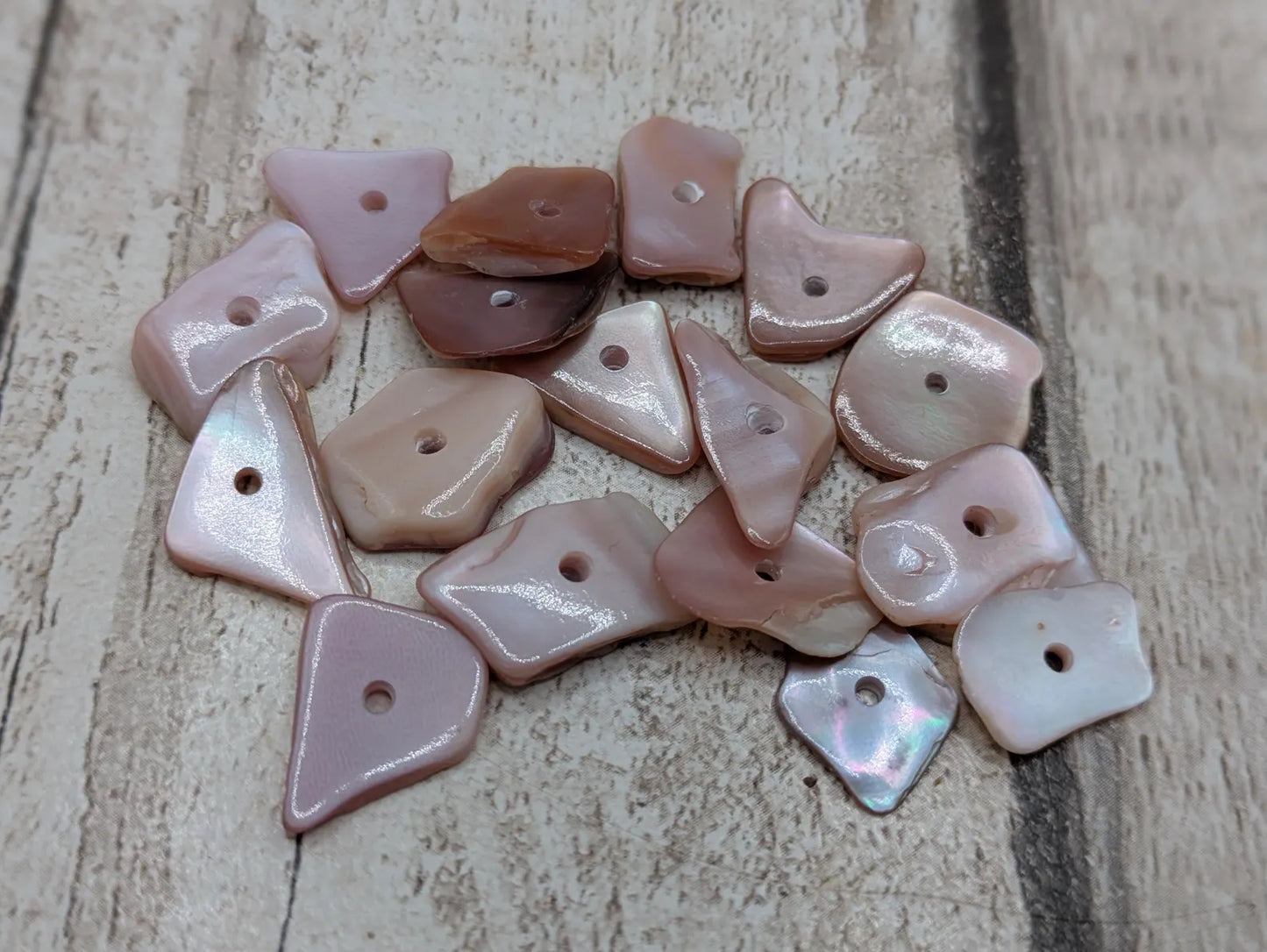 20 centre drilled New Zealand pink fresh water mussel beads.