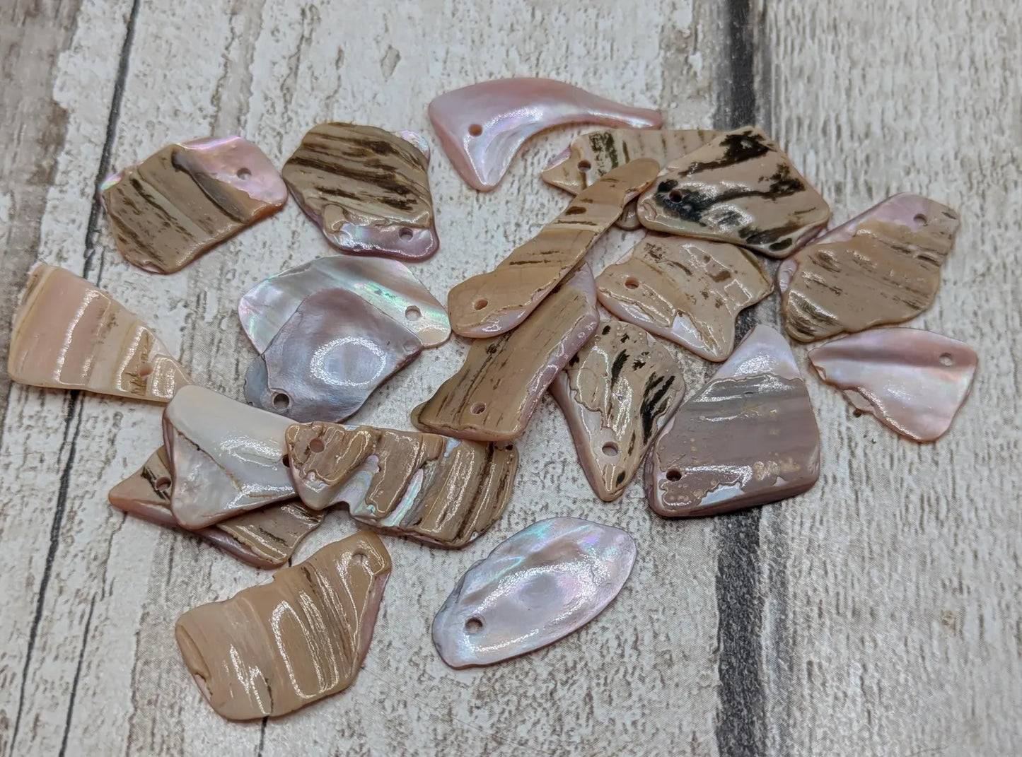 20 top drilled New Zealand pink mussel shell beads.