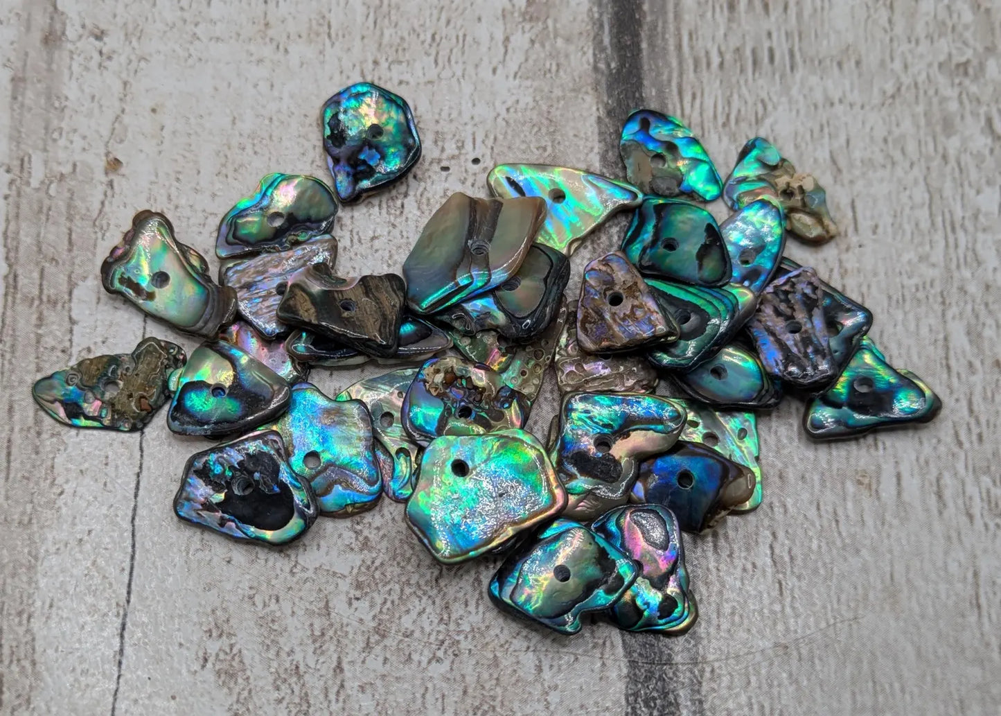 20 New Zealand rainbow pāua abalone shell central tiny beads.