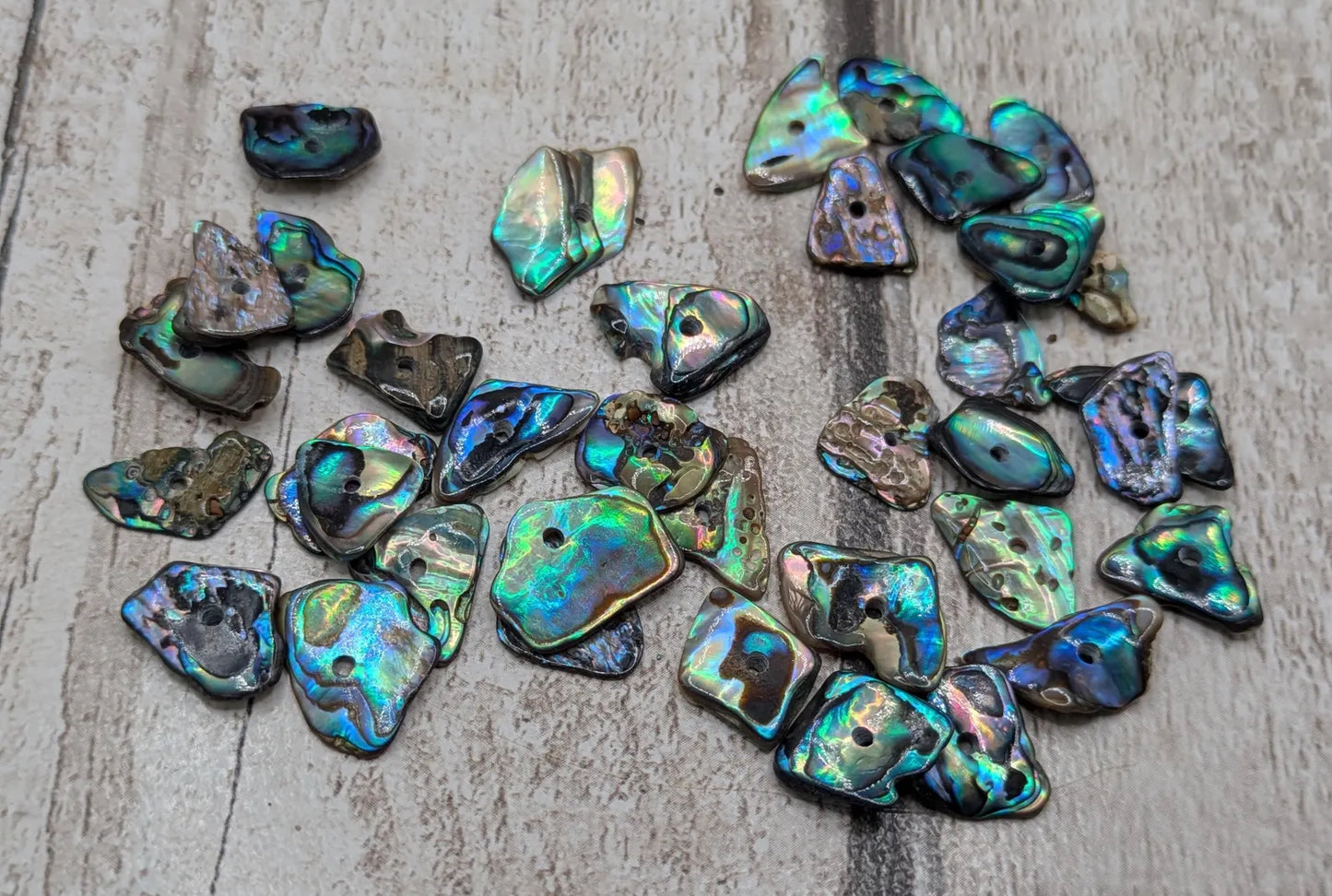 20 New Zealand rainbow pāua abalone shell central tiny beads.