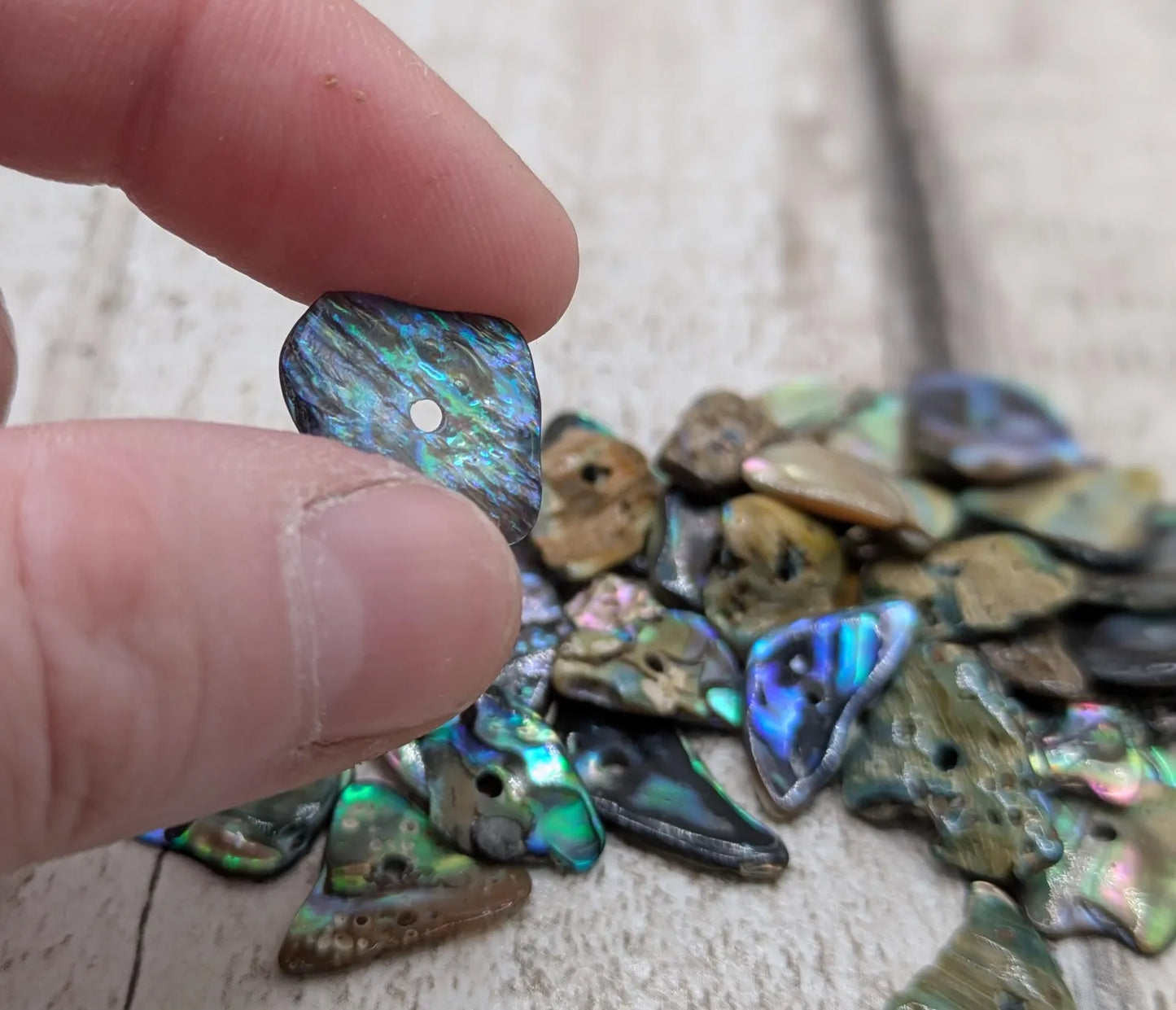 20 New Zealand rainbow pāua abalone shell central tiny beads.