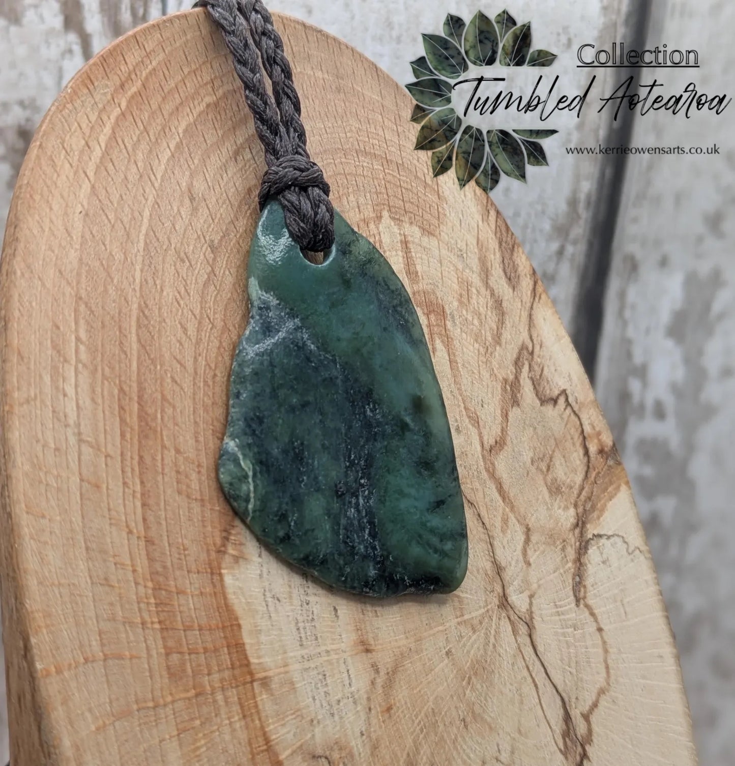 Tumbled New Zealand nephrite jade Pounamu pendant.