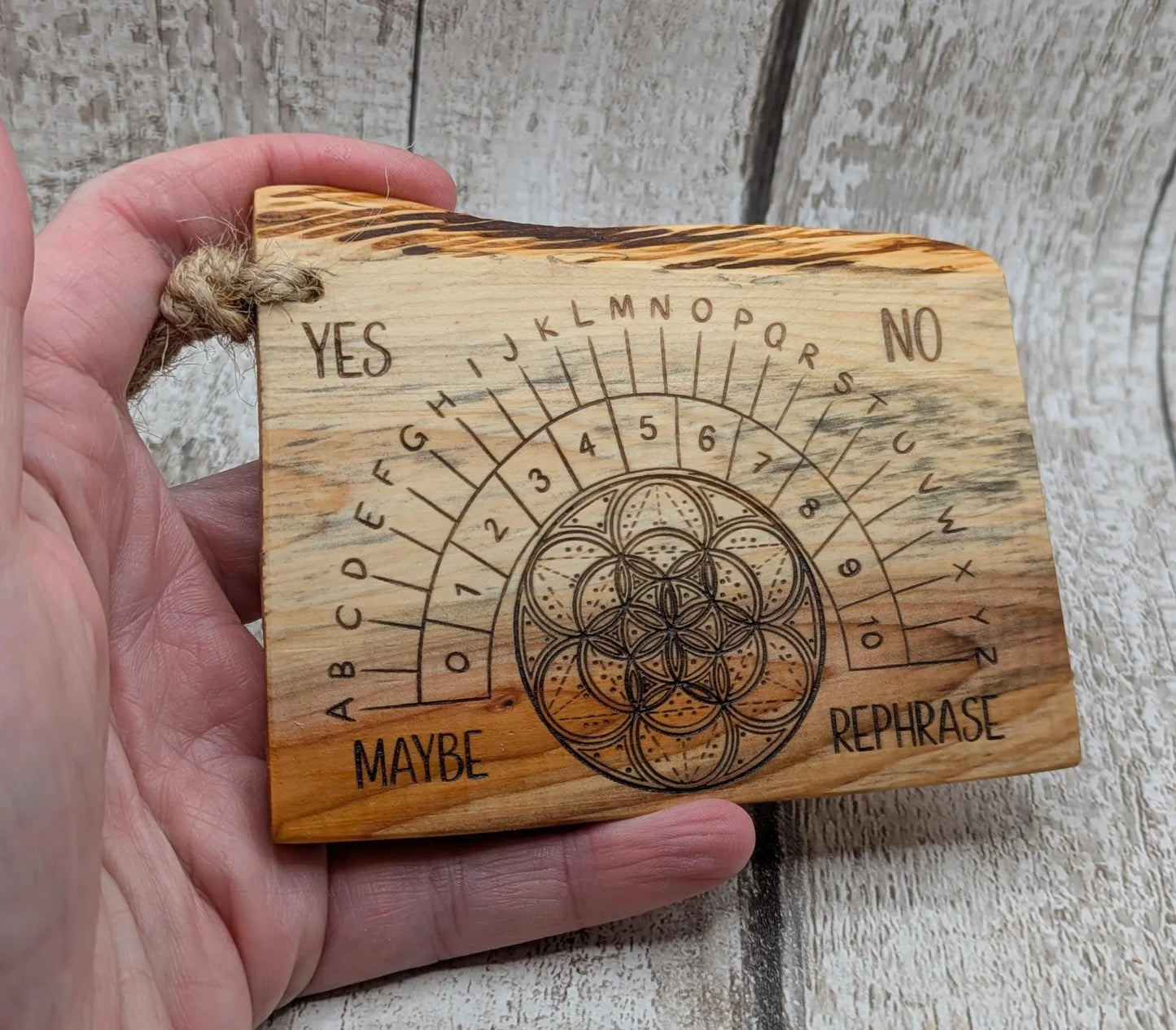 Yew wood travel sized yew wood pendulum board.