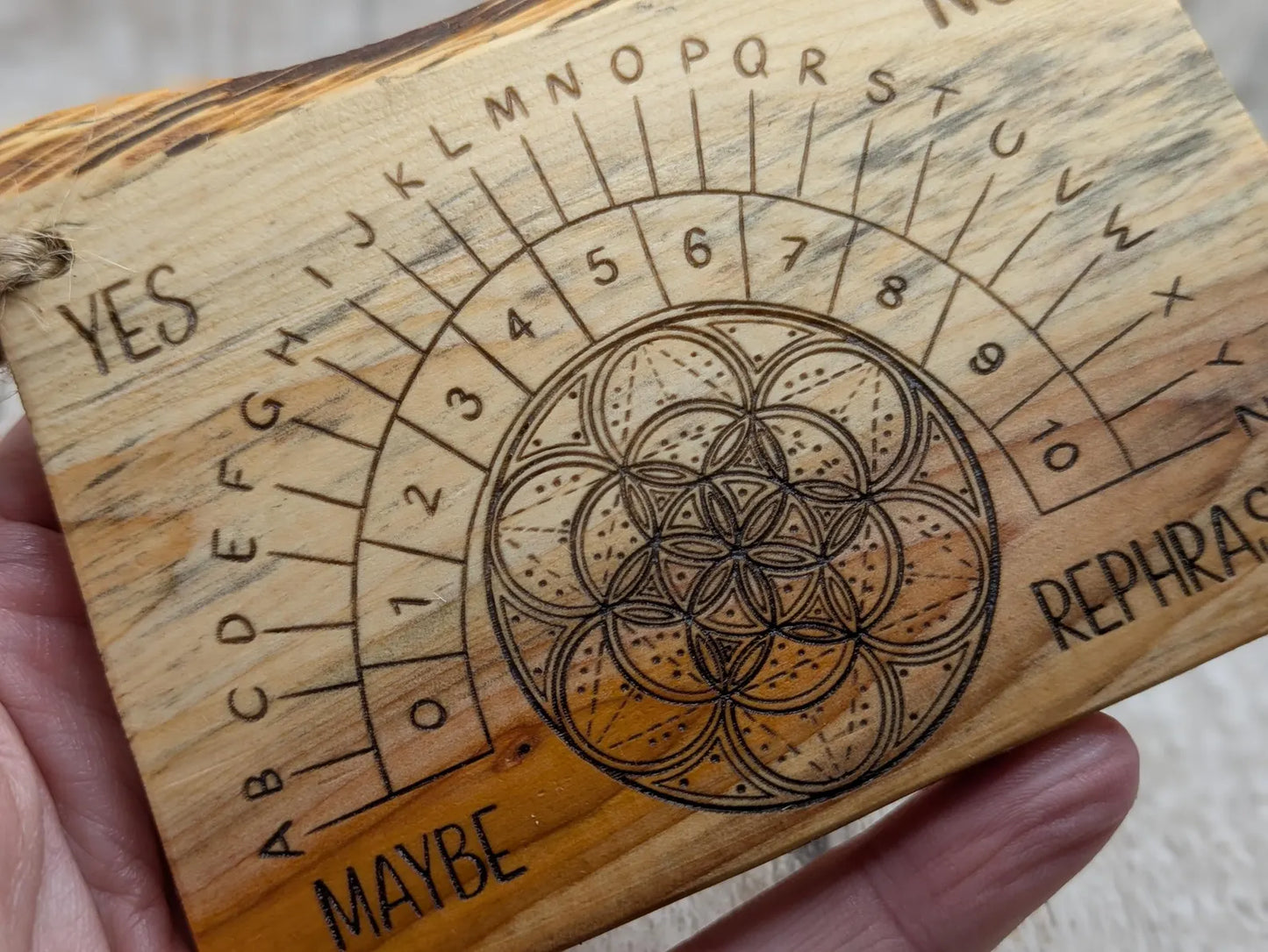 Yew wood travel sized yew wood pendulum board.