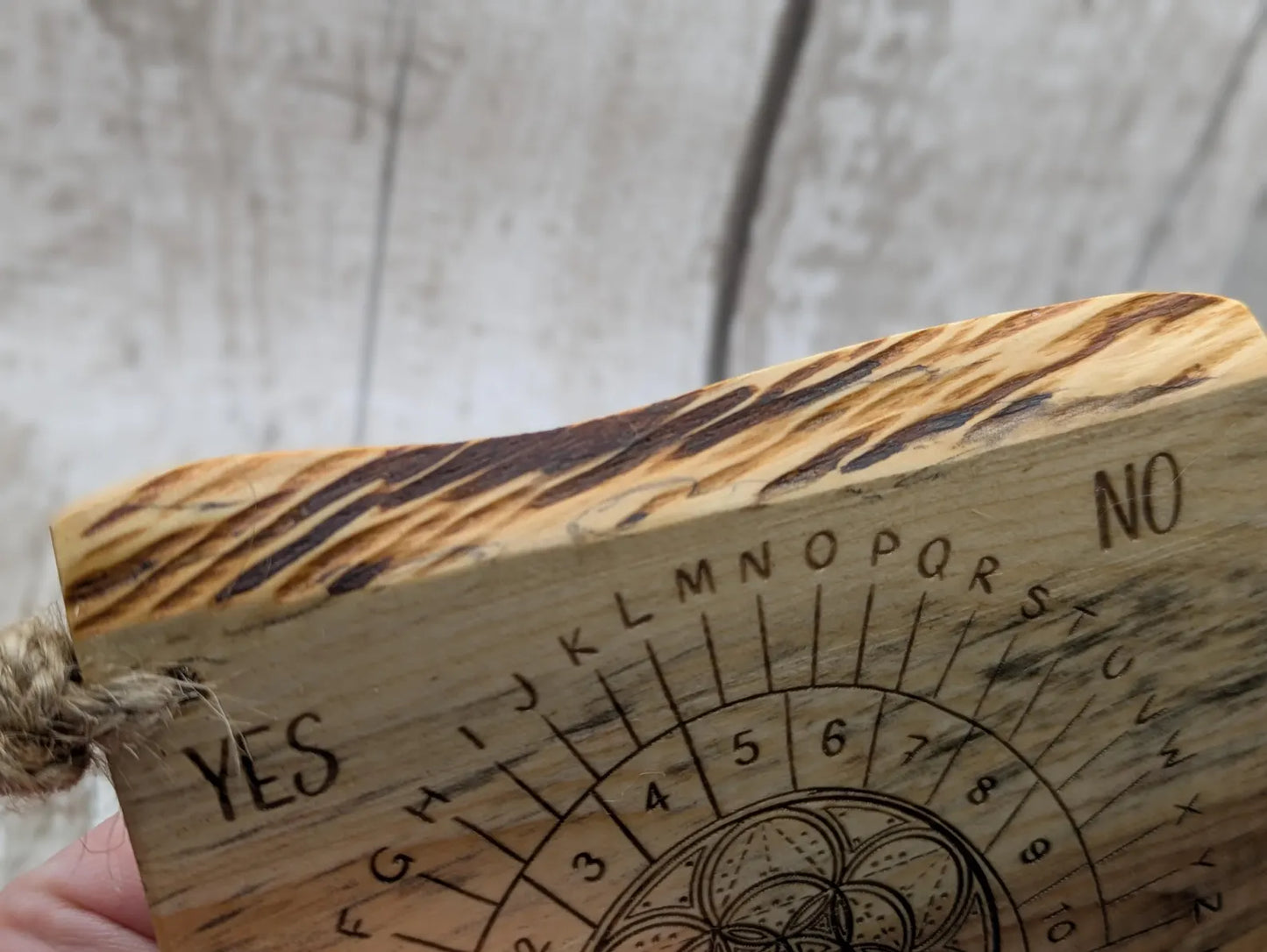 Yew wood travel sized yew wood pendulum board.
