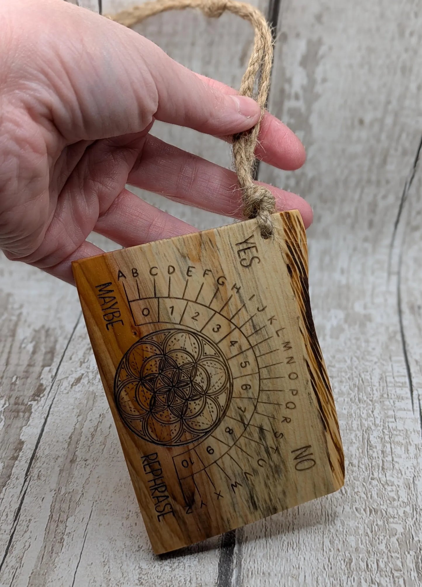 Yew wood travel sized yew wood pendulum board.