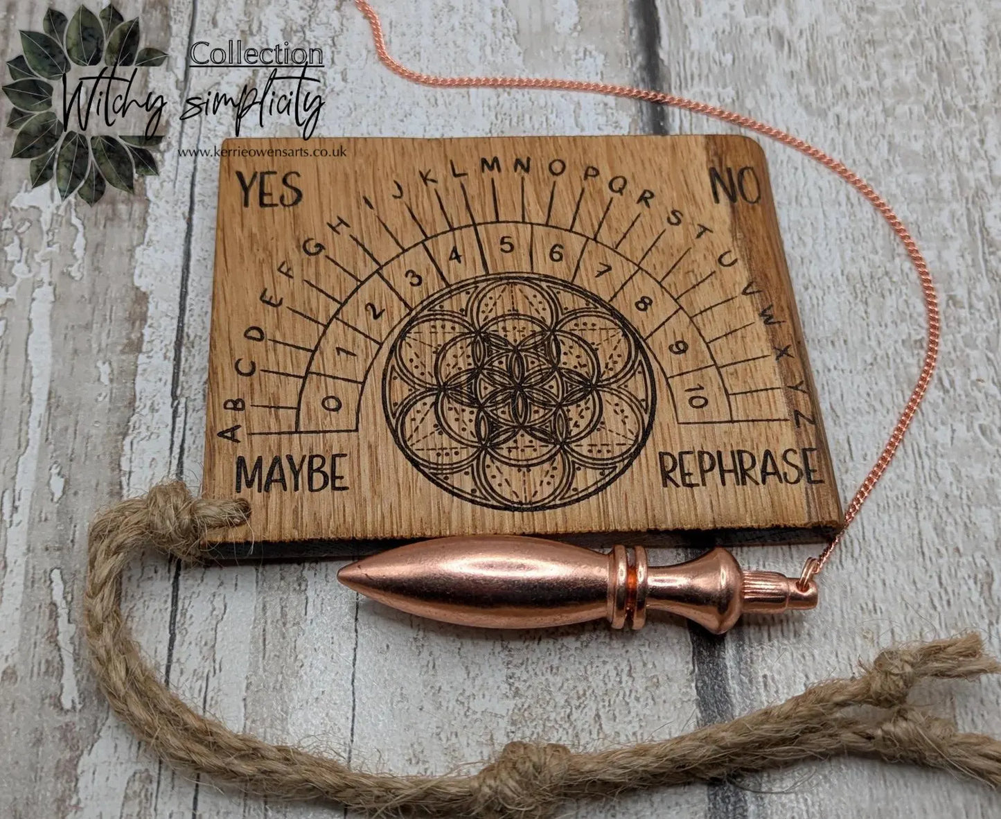 Oak wood travel sized pendulum board with geometric design.