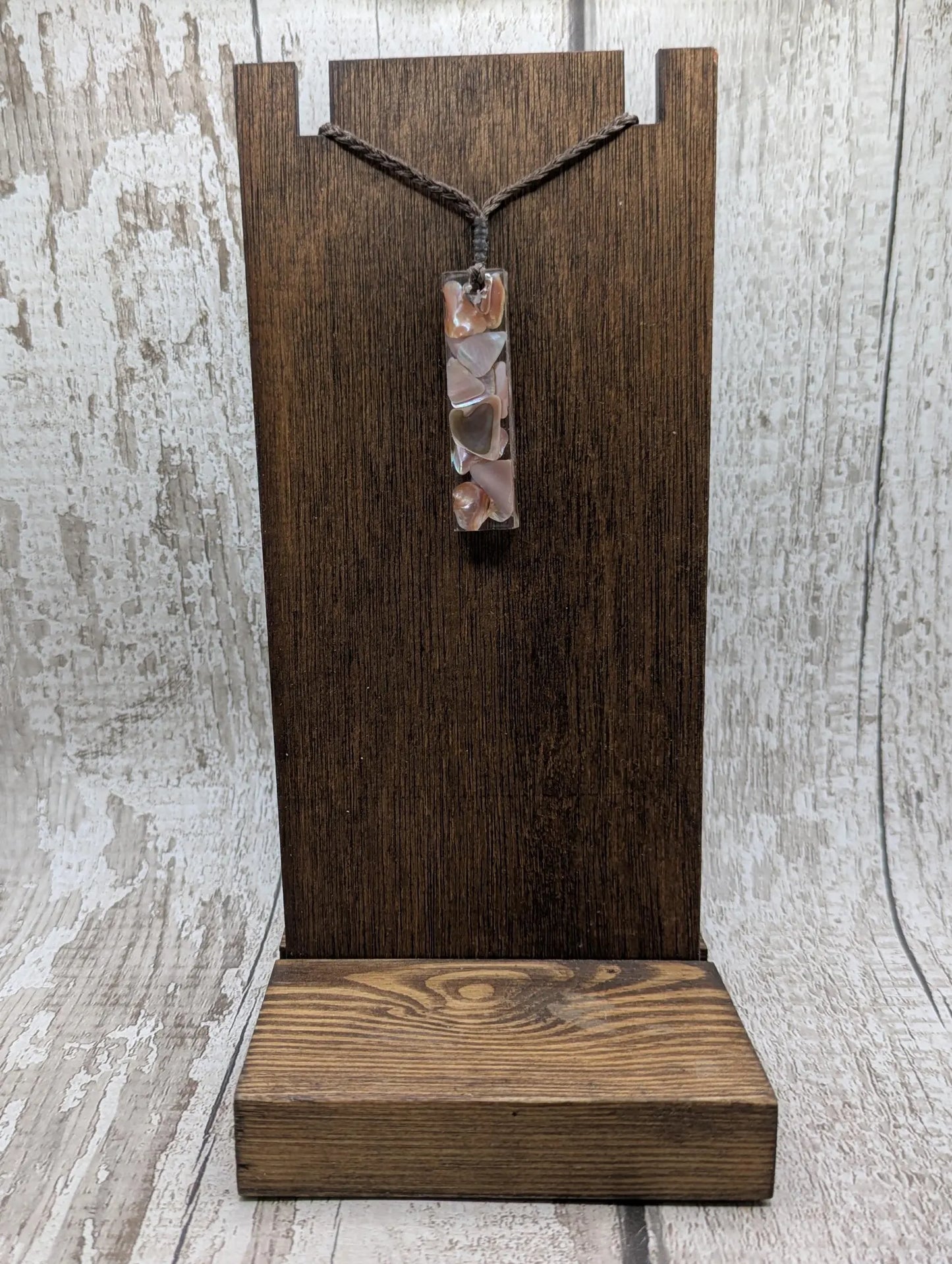 One New Zealand fresh water pink mussel shell in resin.