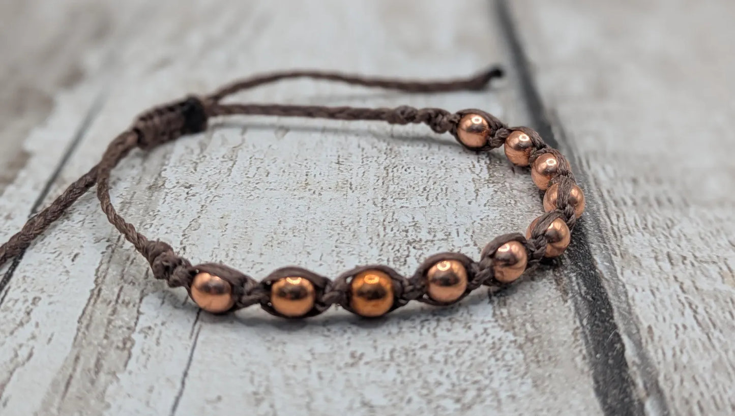 Copper beaded macramé woven adjustable bracelet.