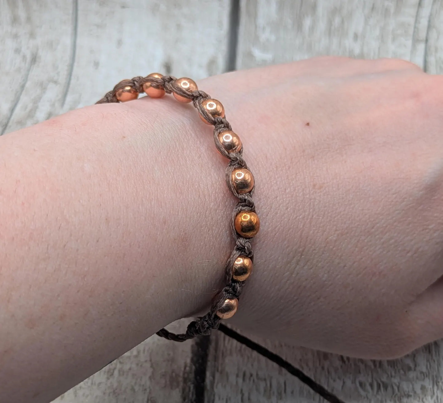 Copper beaded macramé woven adjustable bracelet.