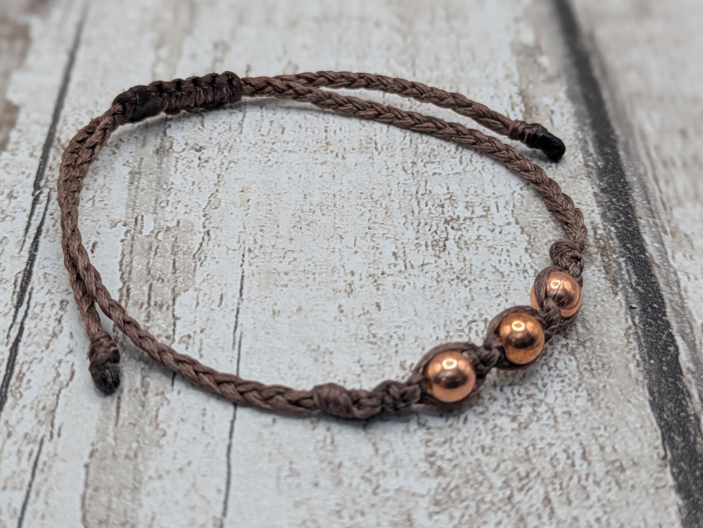 Copper macramé beaded adjustable bracelet.