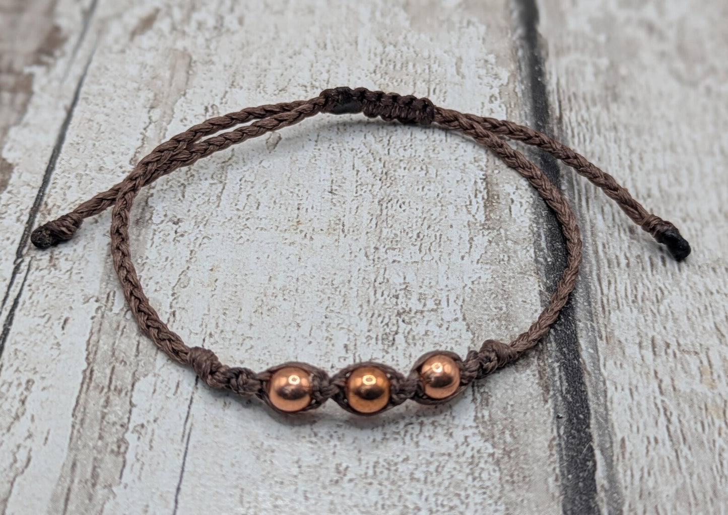 Copper macramé beaded adjustable bracelet.