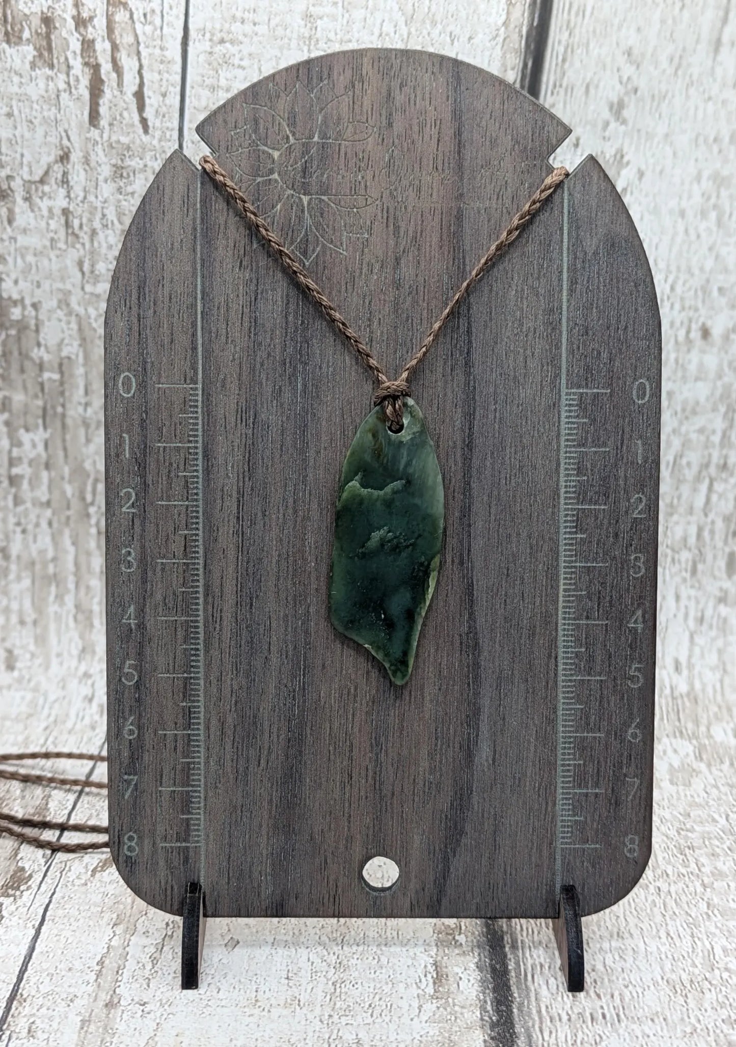 Tumble polished New Zealand pounamu greenstone jade pendant
